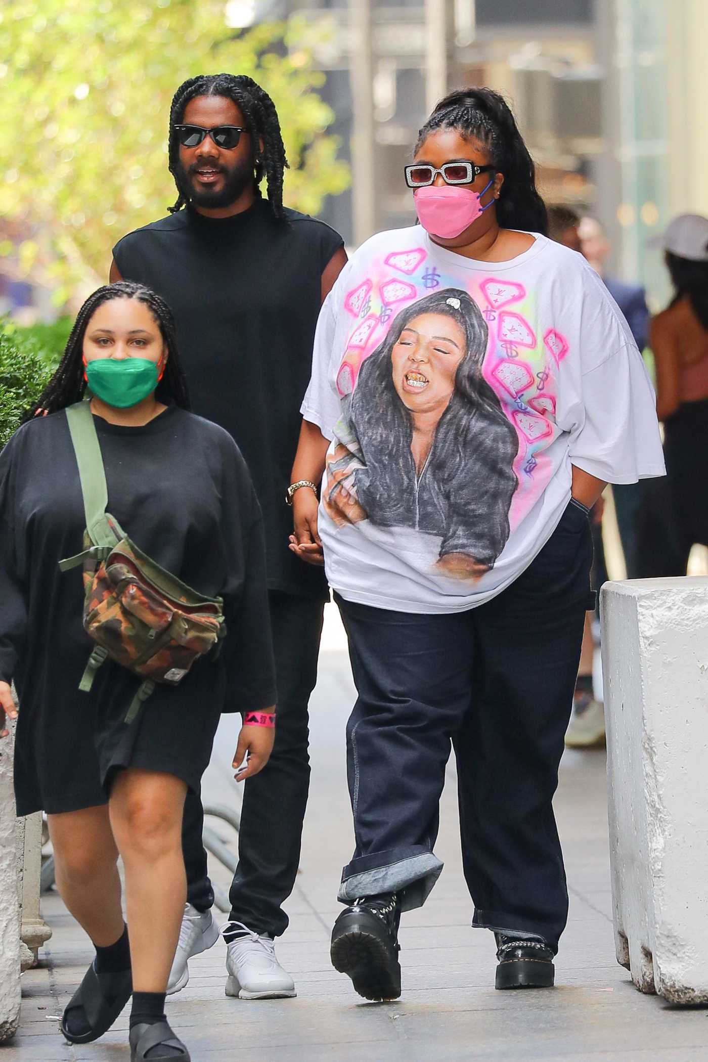 Lizzo in a Pink Protective Mask Leaves a Gucci Store with Her Boyfriend Myke Wright in New York 08/28/2022