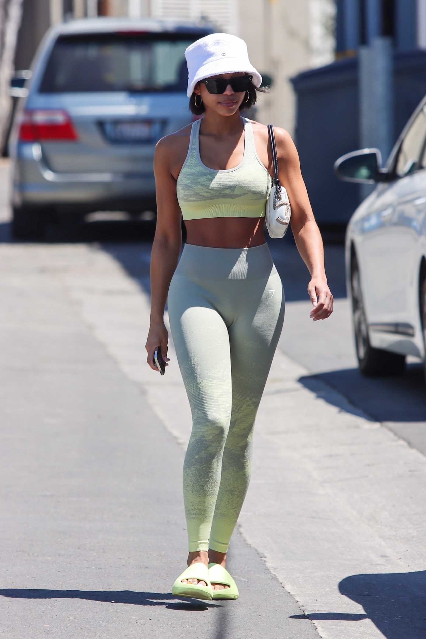 Lori Harvey in a Neon Green Flip-Flops Leaves Her Morning Pilates Class in West Hollywood 08/13/2022