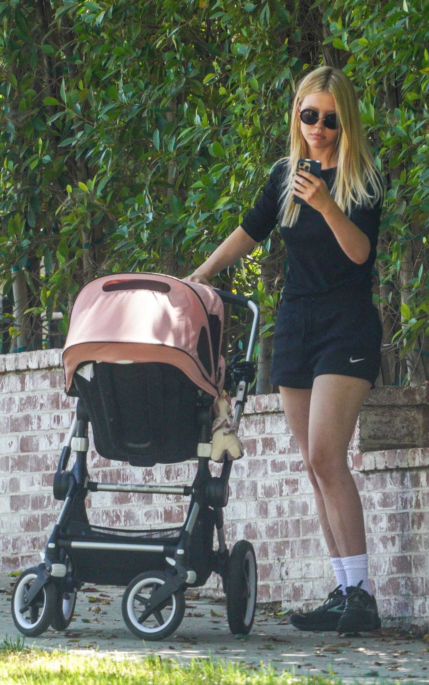 Mia Goth in a Black Shorts Takes Her Baby for a Stroll Out in Los Angeles 08/27/2022