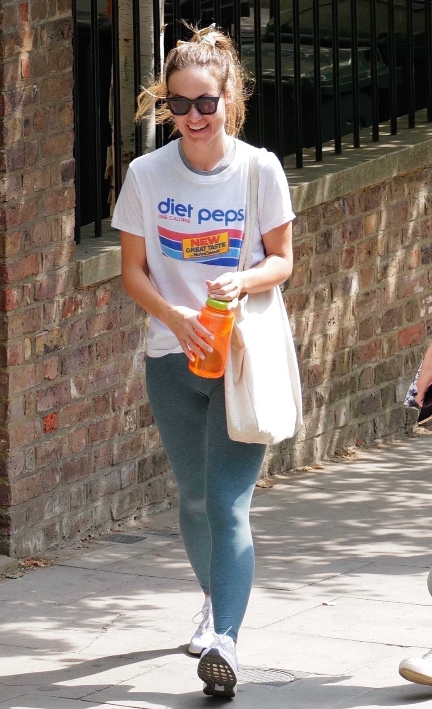 Olivia Wilde in a White Tee Was Seen Out in London 08/14/2022