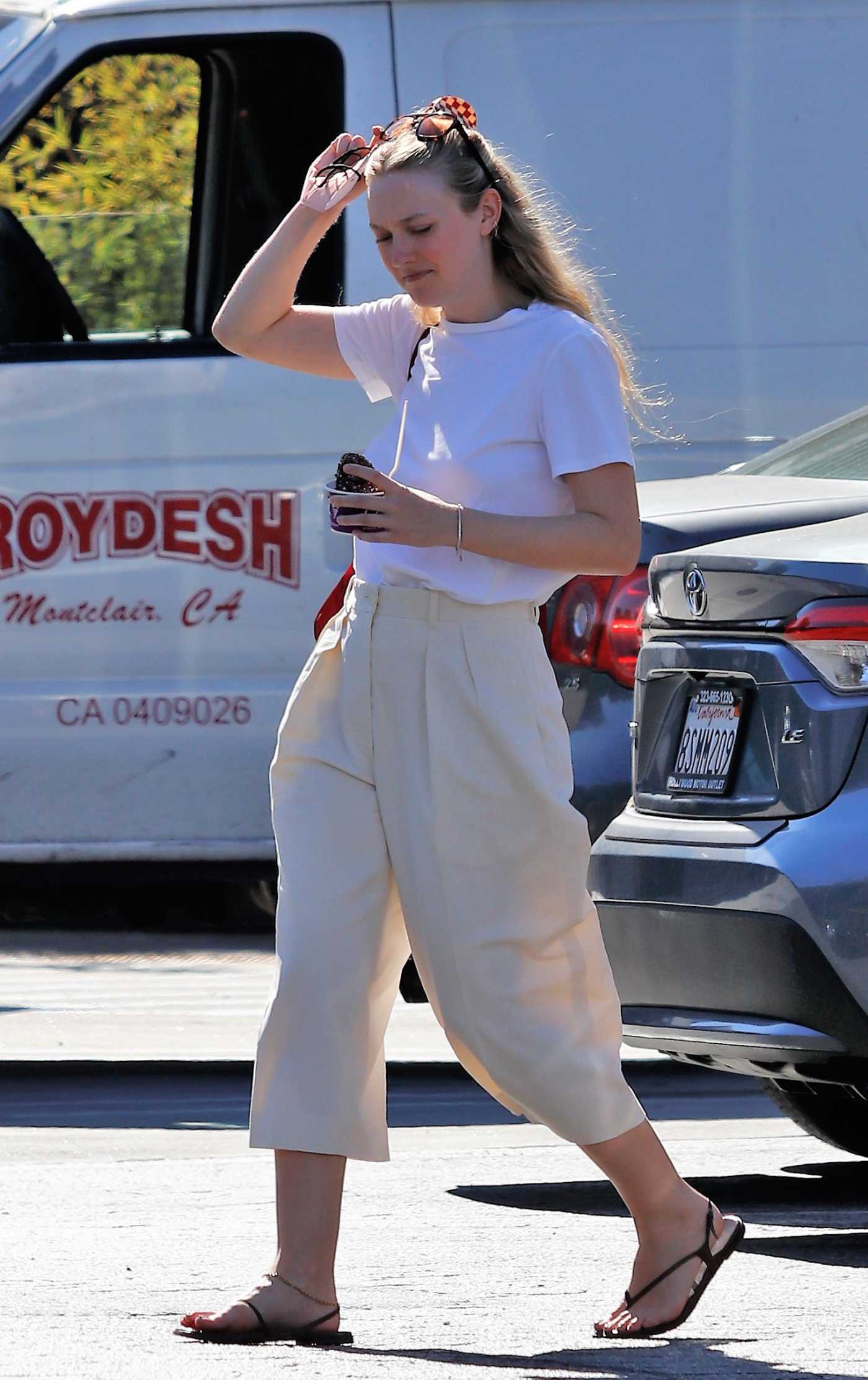 Dakota Fanning in a White Tee Goes Shopping in Los Angeles 08/31/2022