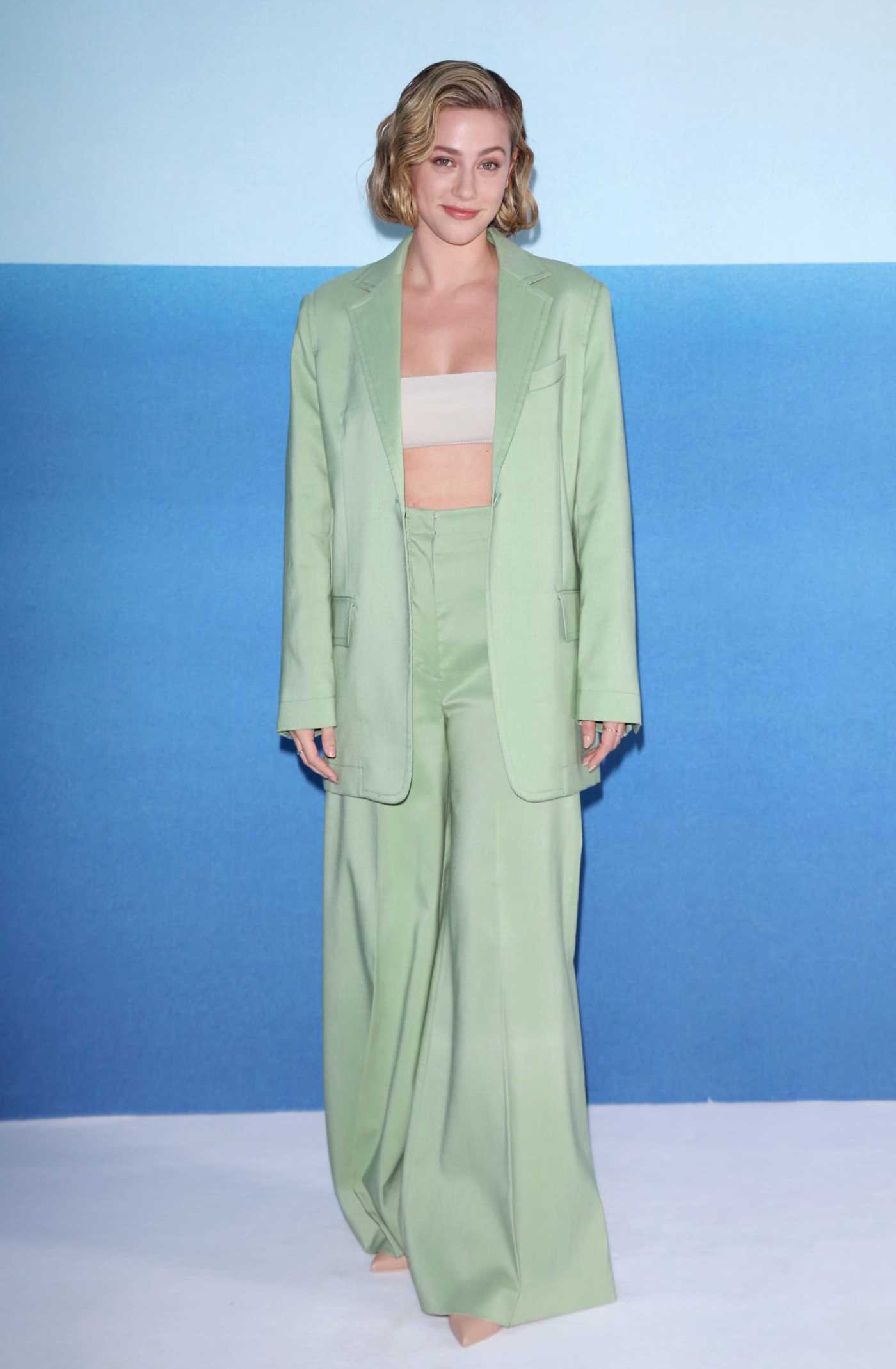 Lili Reinhart in a Light Green Pantsuit Attends the Max Mara Fashion Show During 2022 Milan Fashion Week in Milan 09/22/2022