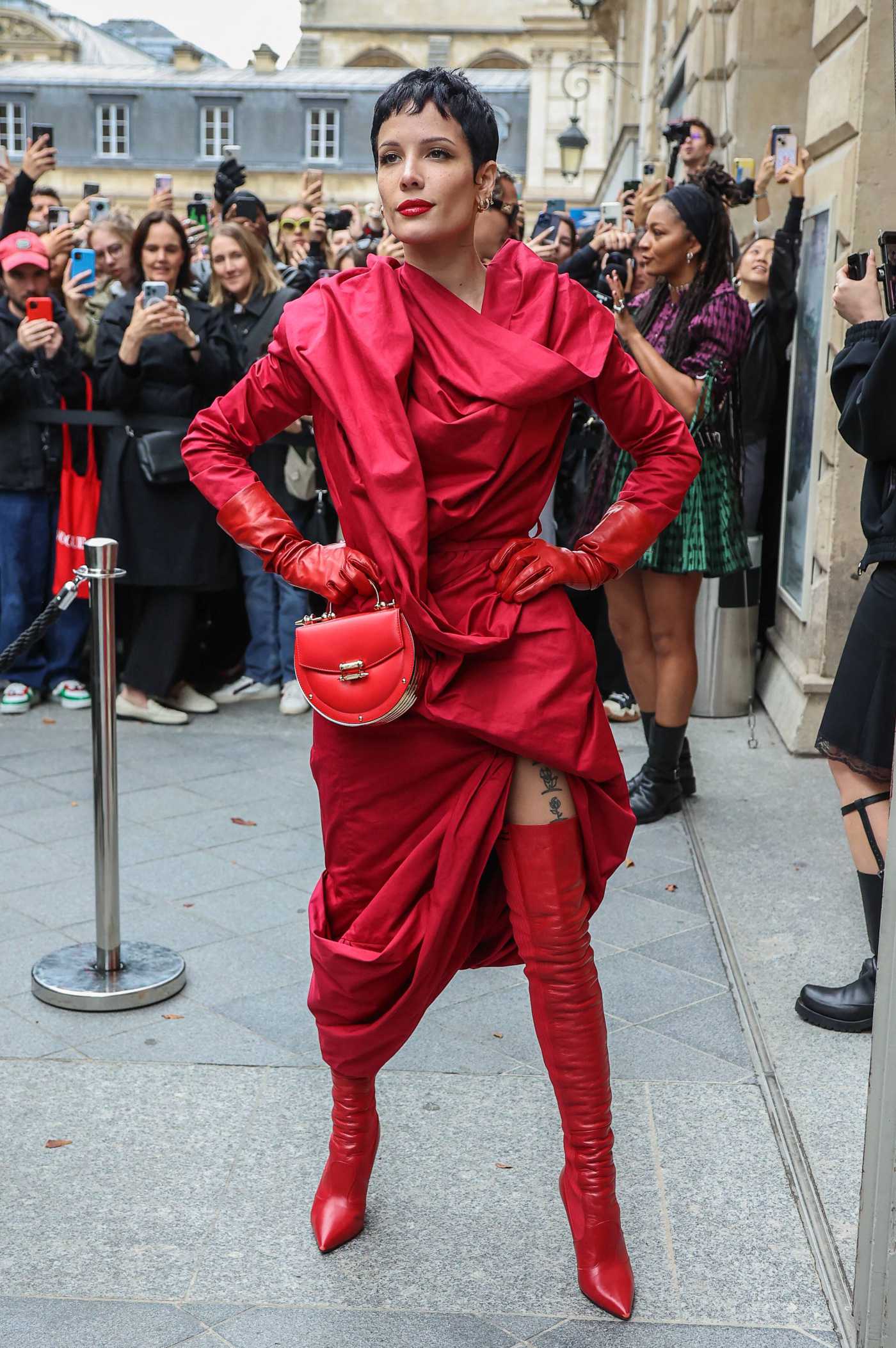 Halsey in a Red Ensemble Arrives at Vivienne Westwood Womenswear Fashion Show During 2022 Paris Fashion Week in Paris 10/01/2022