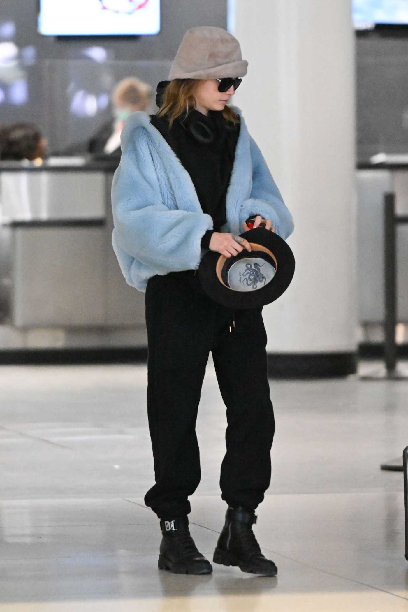 Cara Delevingne in a Black Sweatpants Arrives at JFK Airport in New York 10/29/2022
