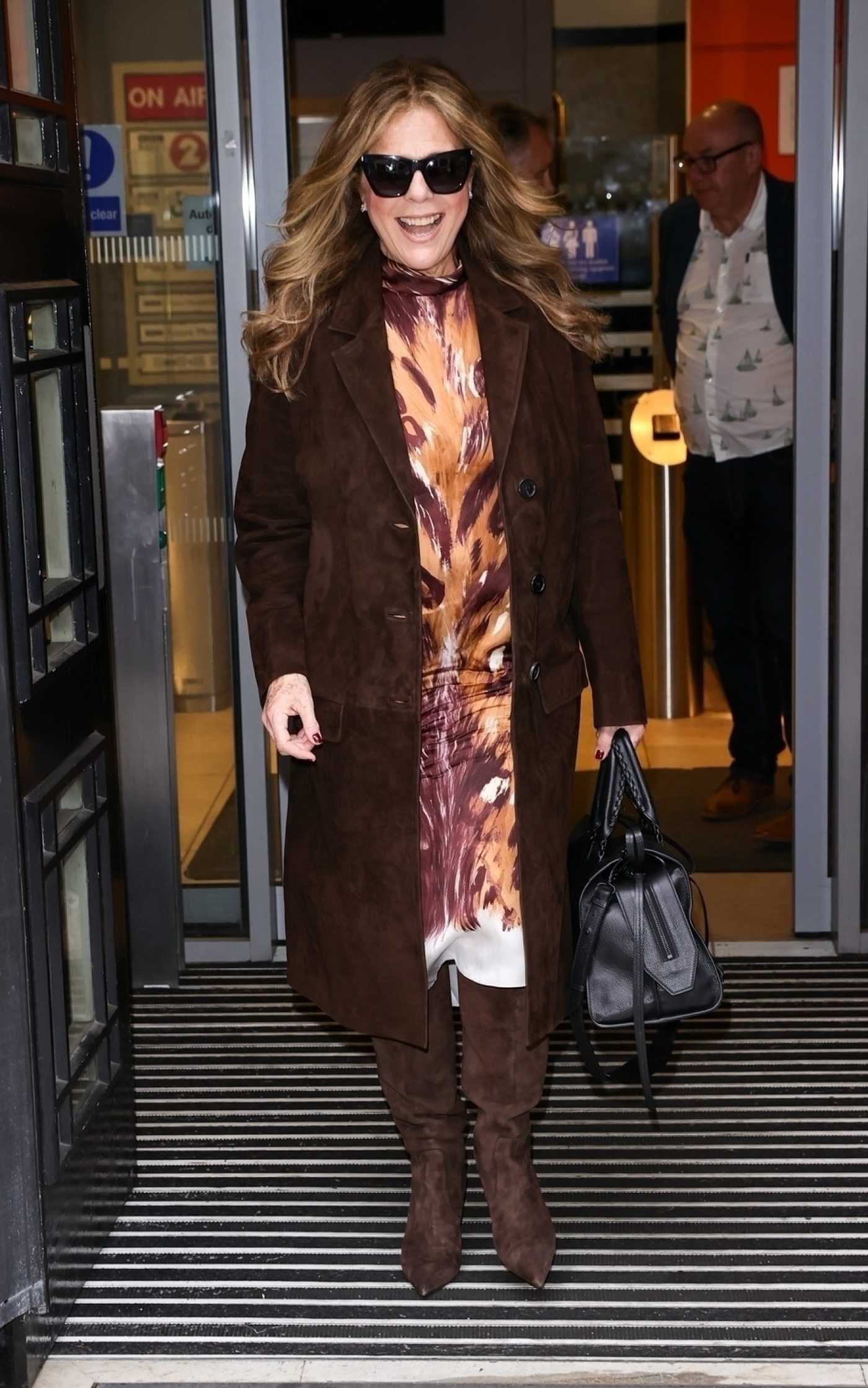 Rita Wilson in a Brown Suede Coat Exits from the Claudian Winkleman Show in London 11/26/2022