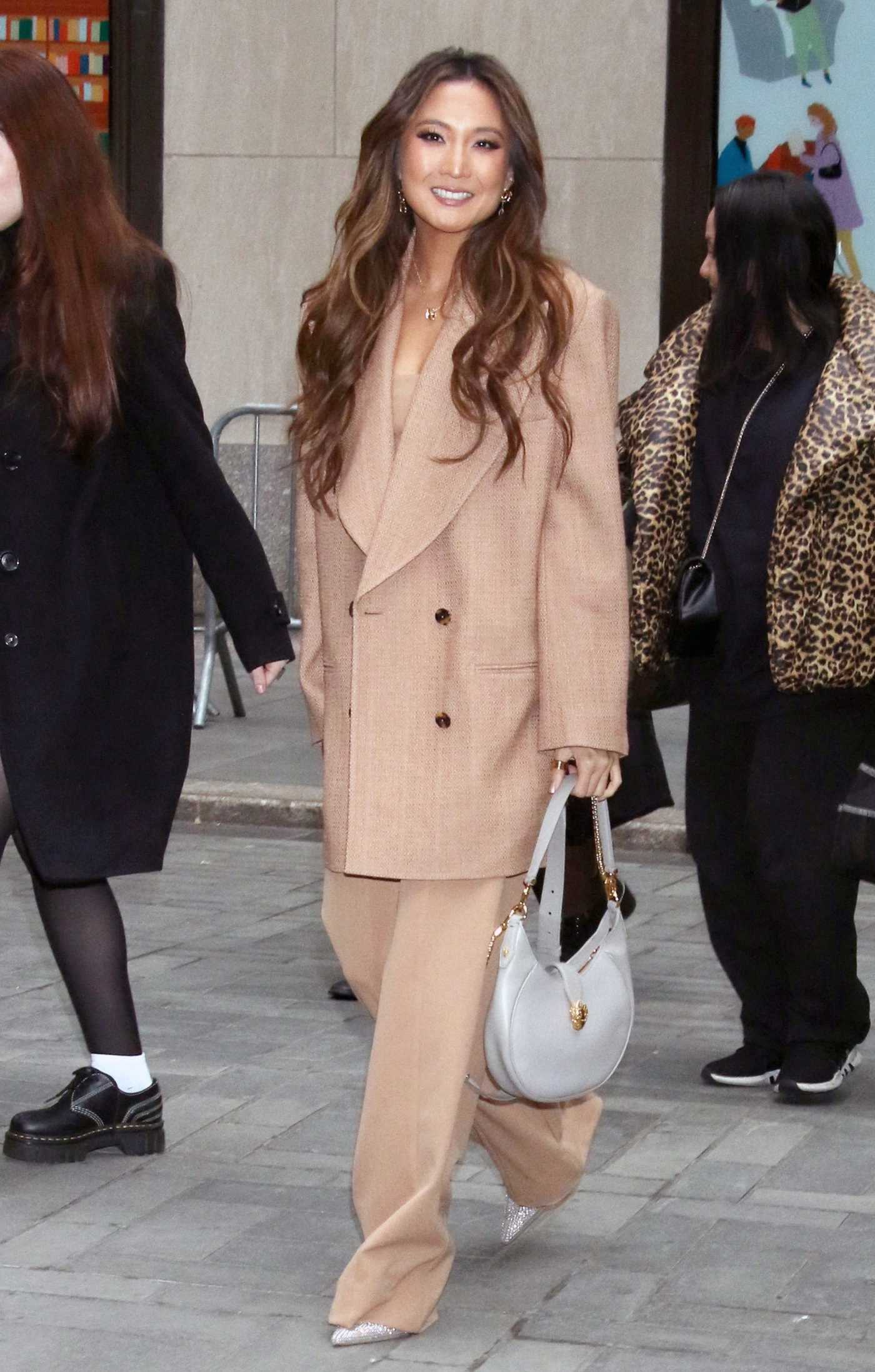 Ashley Park in a Beige Pantsuit Arrives at NBC's Today Show in New York 12/15/2022