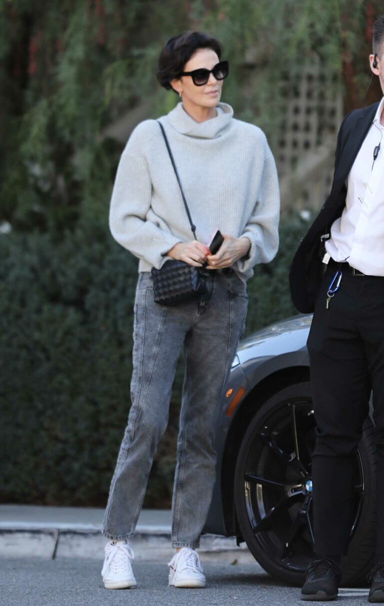 Charlize Theron in a Grey Neck Knitted Sweater