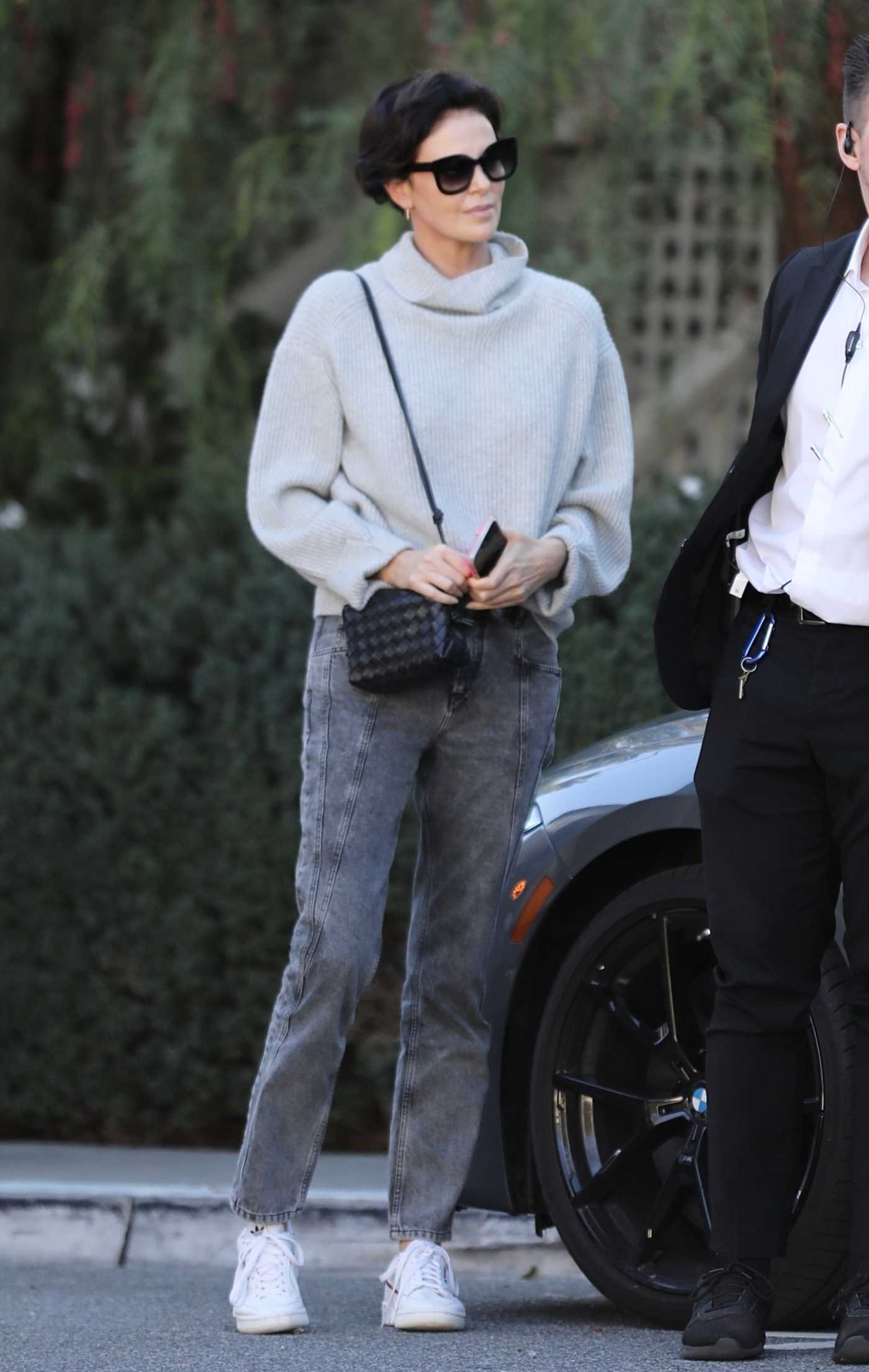 Charlize Theron in a Grey Neck Knitted Sweater Was Seen Out in Los Angeles 12/12/2022