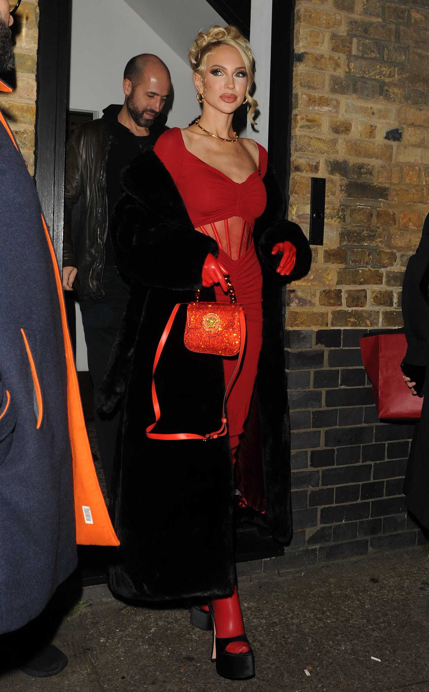 Christine Quinn in a Red Dress Leaves Rita Ora's Fashion Awards After Party at The Chiltern Firehouse in London 12/06/2022
