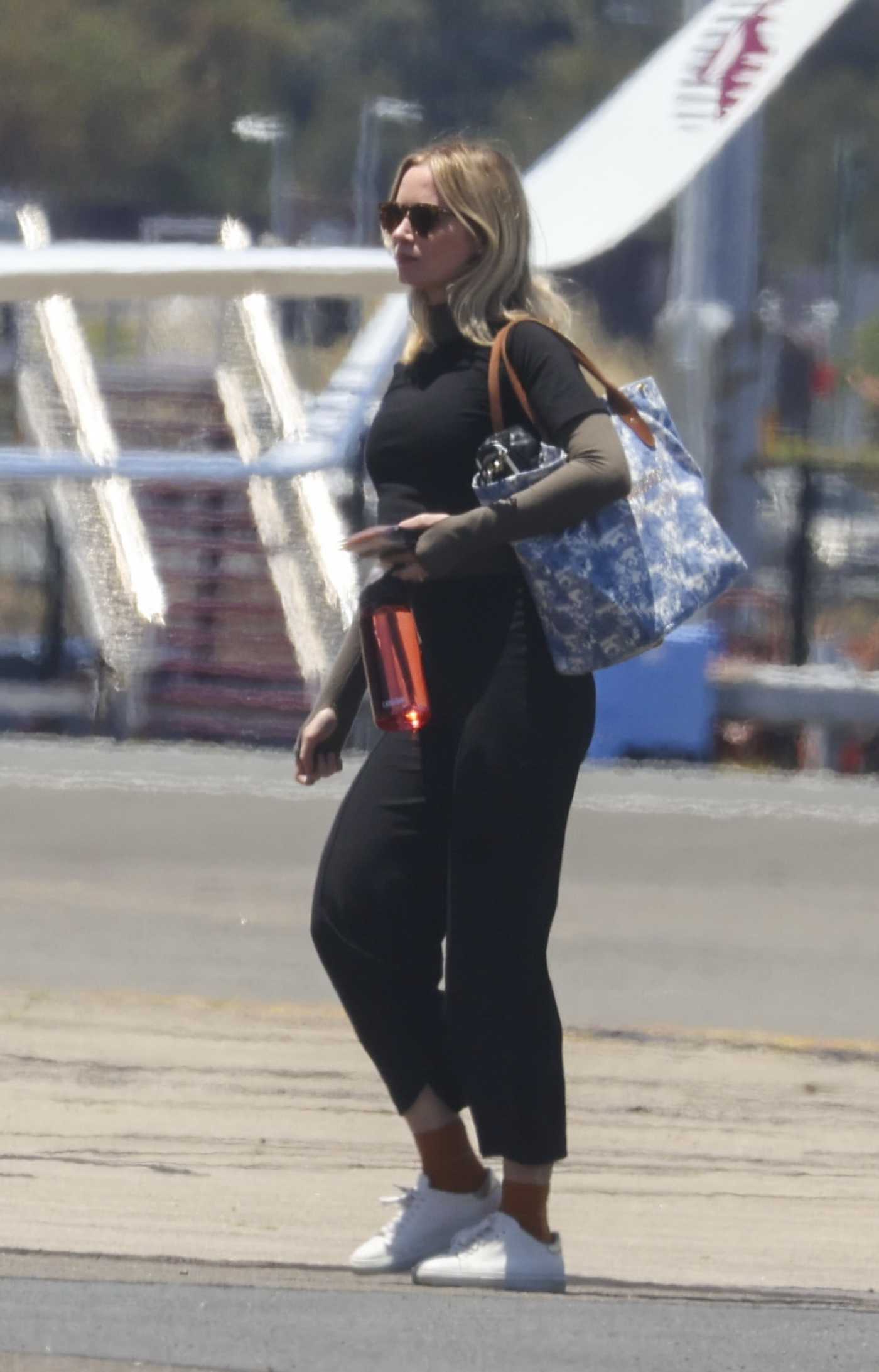 Emily Blunt in a White Sneakers Arrives Back on a Private Jet in Sydney 12/28/2022