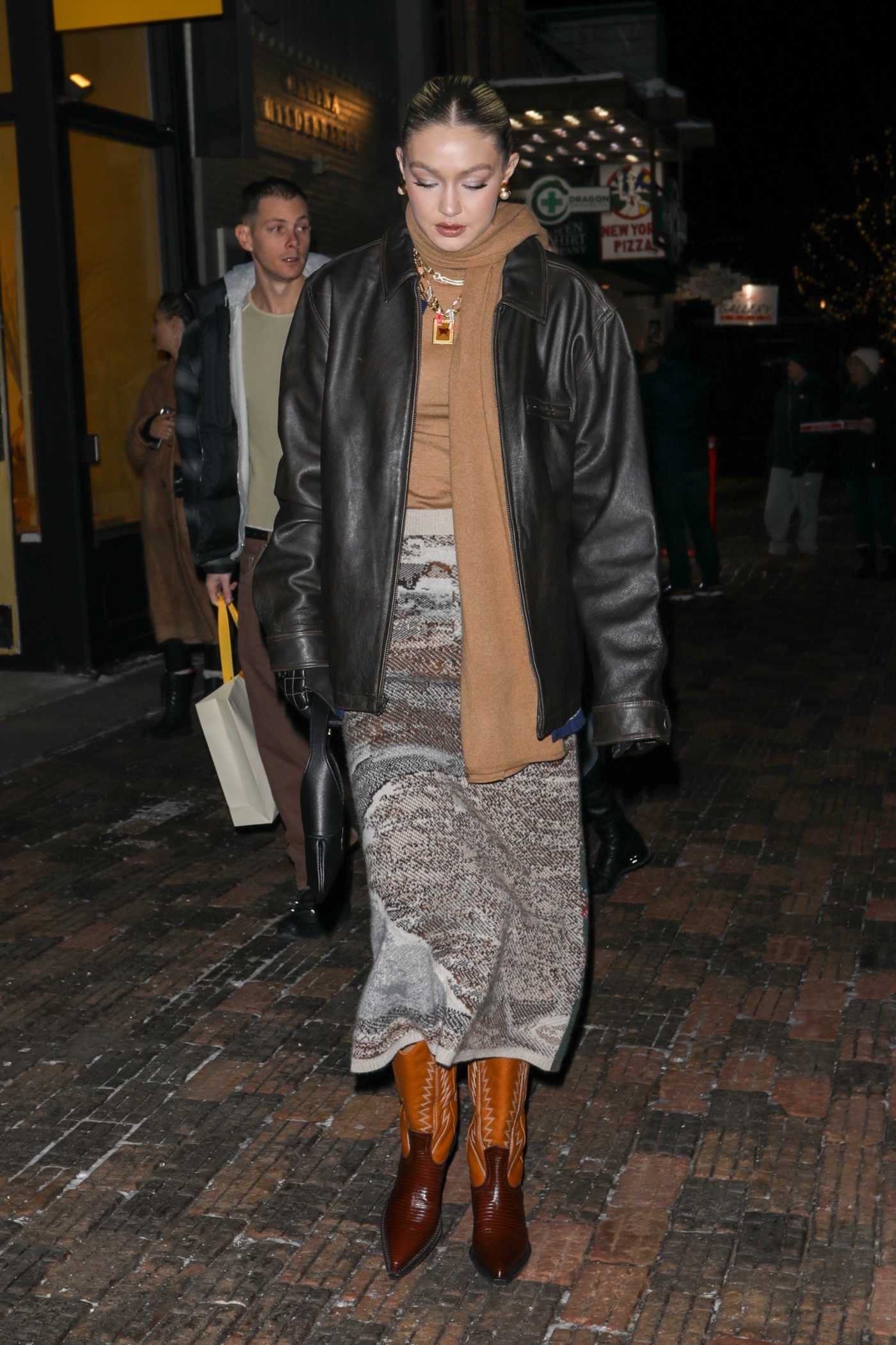 Gigi Hadid in a Black Leather Jacket Visits Guest in Residence Clothing Store in Aspen 12/18/2022