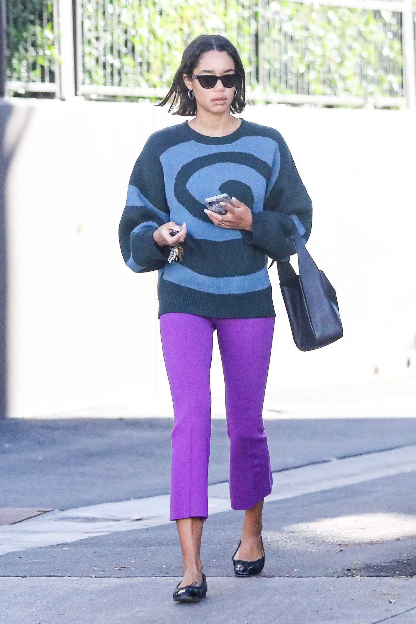 Laura Harrier in a Purple Pants Leaves a Nail Salon in Beverly Hills 12/08/2022