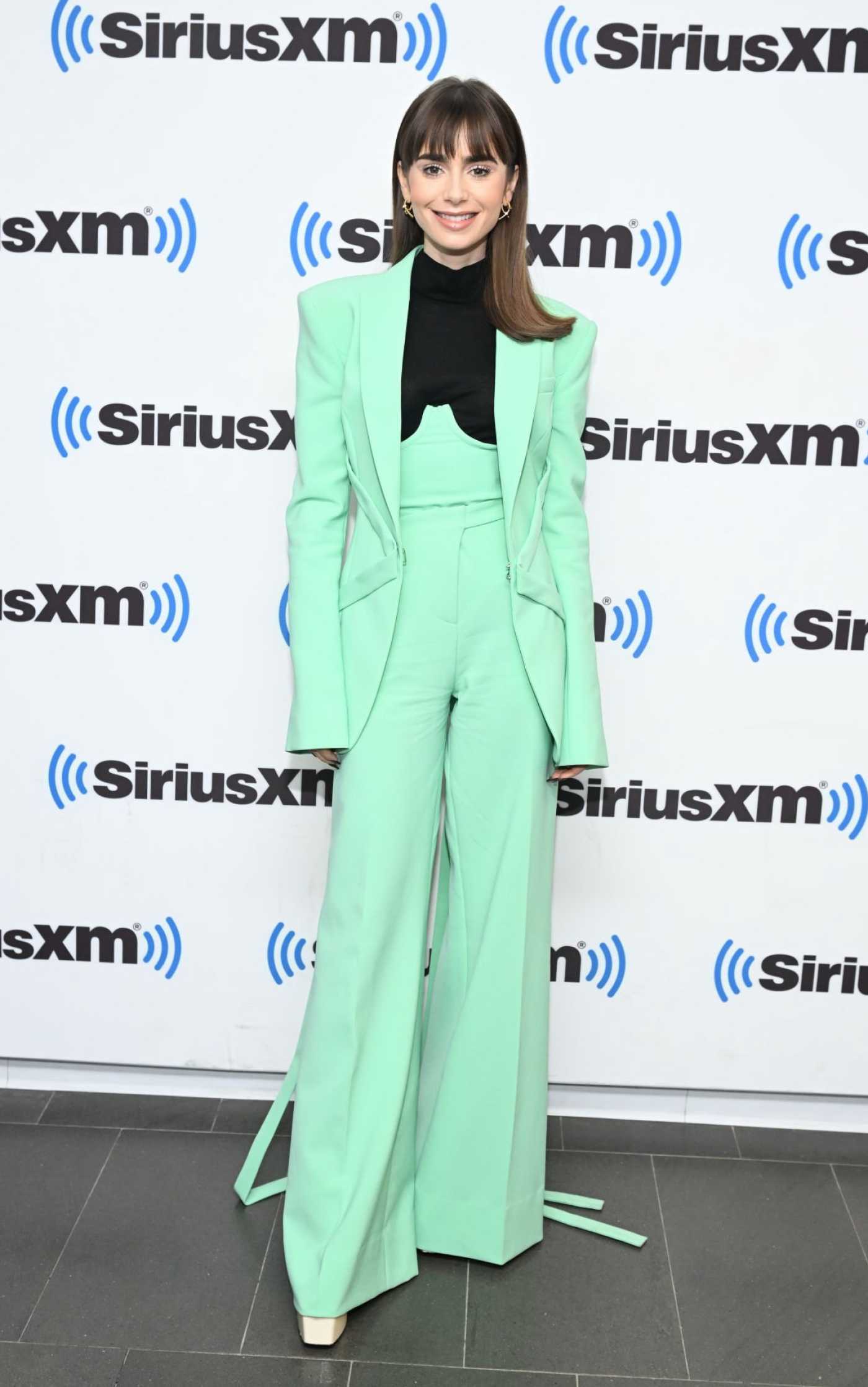 Lily Collins Attends the SiriusXM Town Hall in New York 12/14/2022