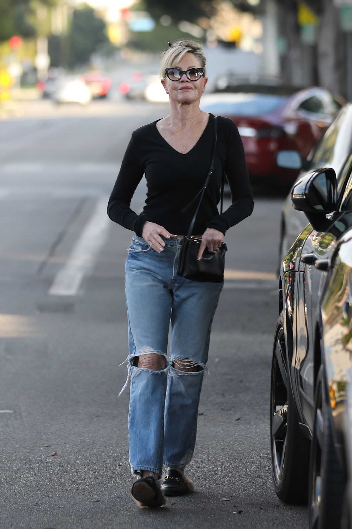 Melanie Griffith in a Blue Ripped Jeans Leaves Chris McMillan's Hair Salon in Beverly Hills 12/28/2022