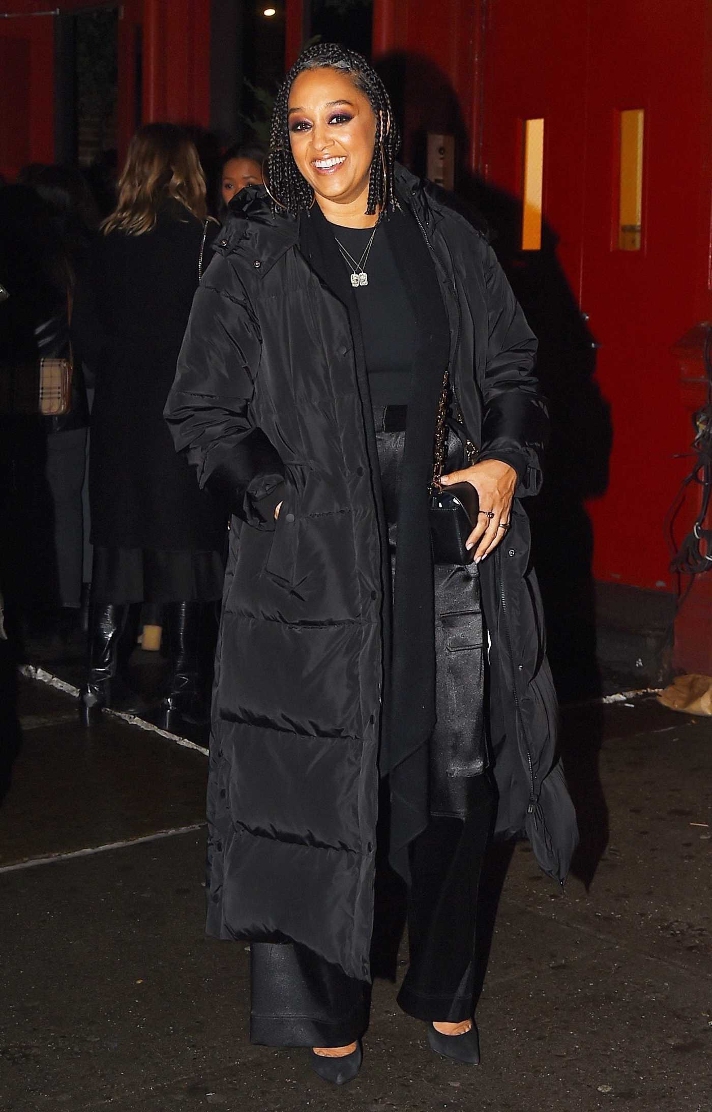 Tia Mowry in a Black Puffer Coat Leaves Acme Restaurant with Her Brother Tahj Mowry in New York 12/17/2022