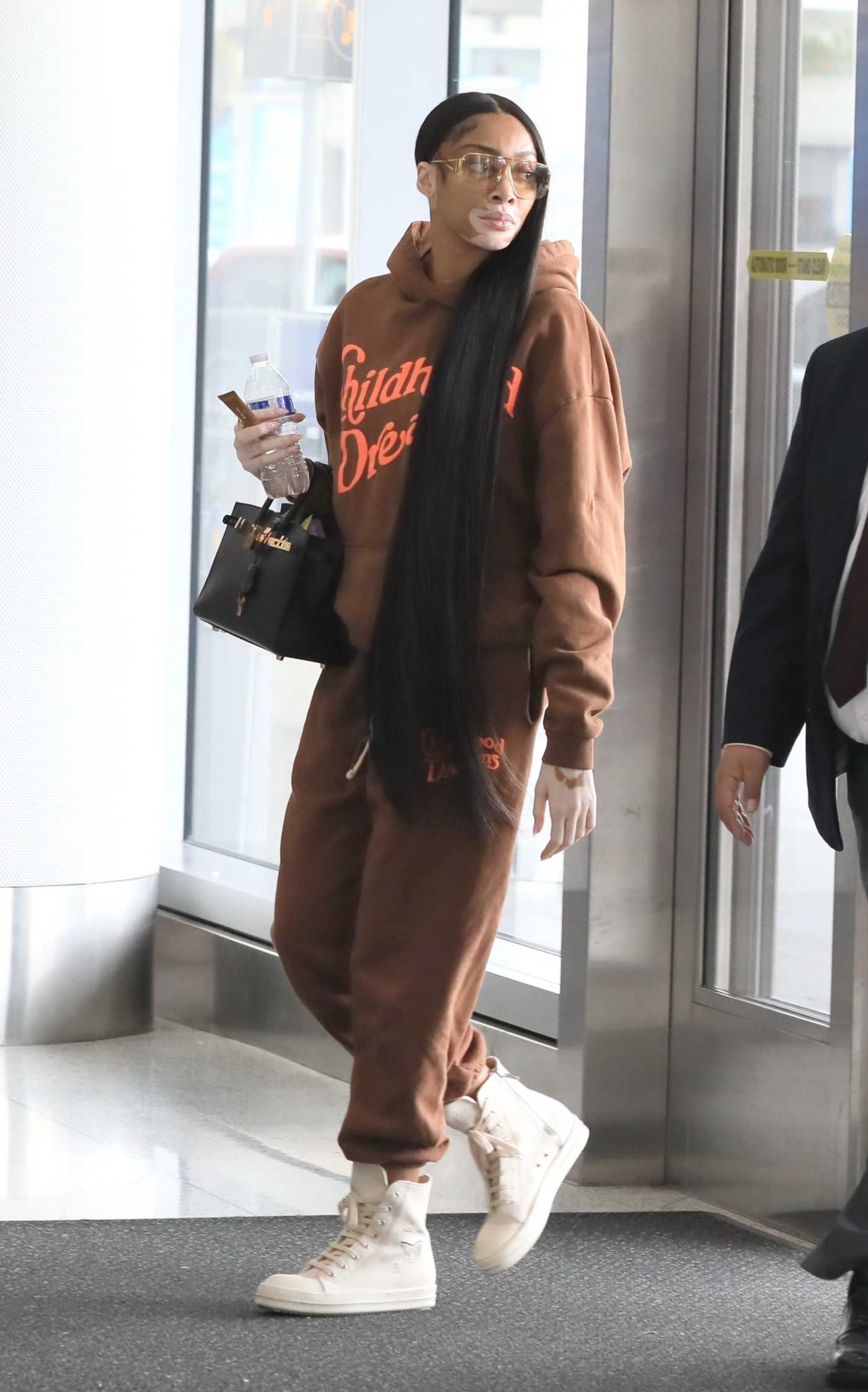 Winnie Harlow in a Tan Sweatsuit Arrives at LAX Airport in Los Angeles 12/01/2022
