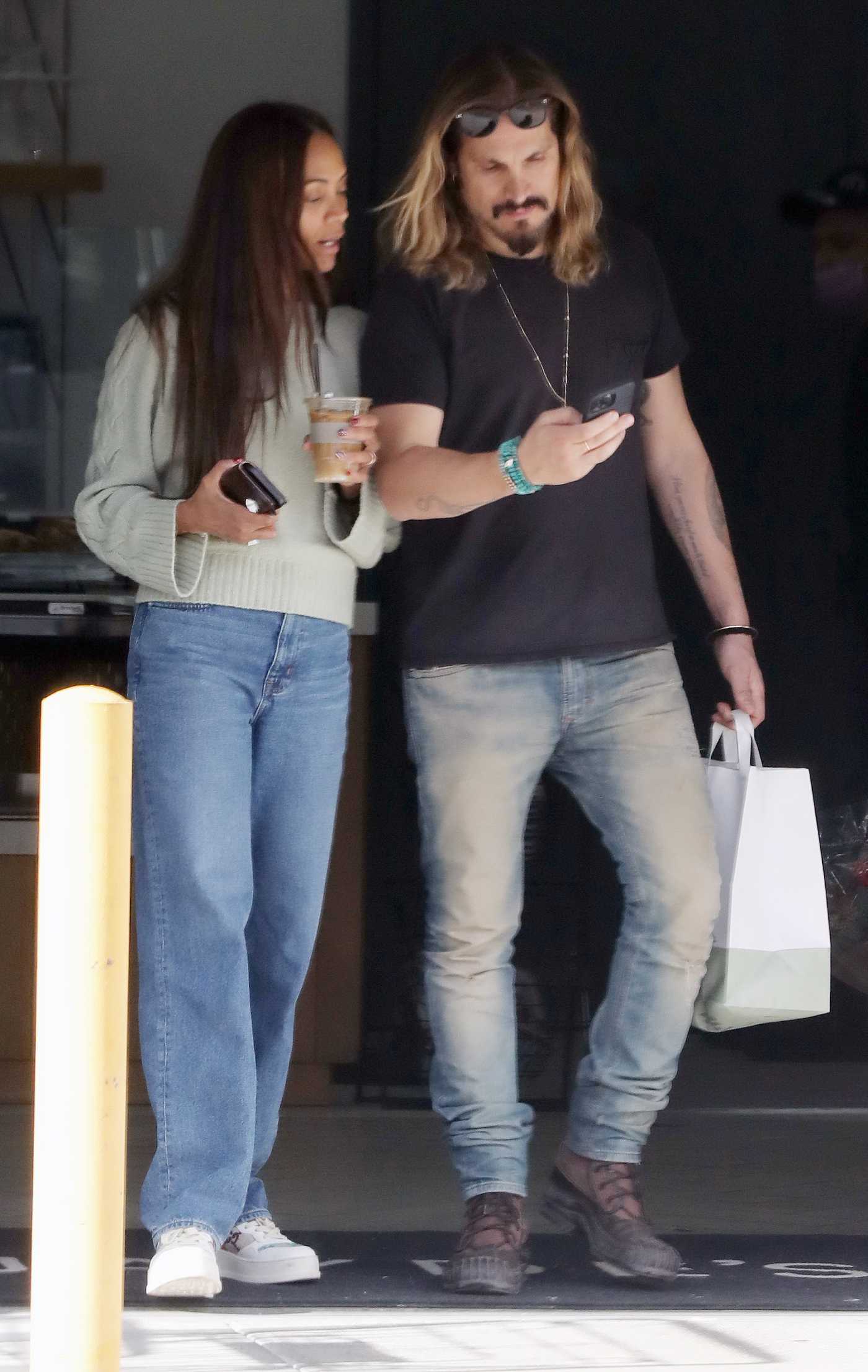 Zoe Saldana in a White Sneakers Was Seen Out with Marco Perego in Los Angeles 12/26/2022