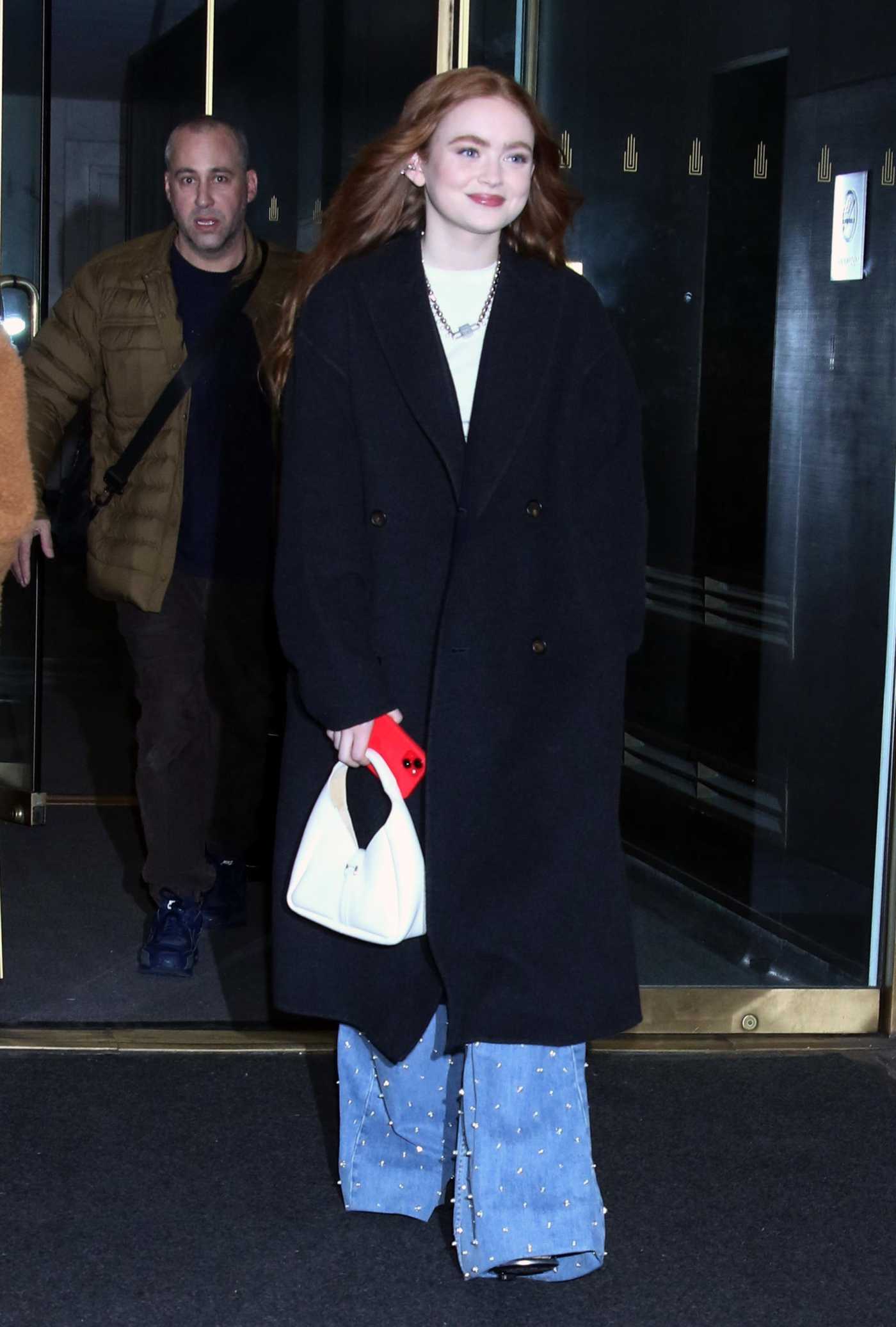 Sadie Sink in a Black Coat Leaves the NBC's Today Show in New York 01/04/2023