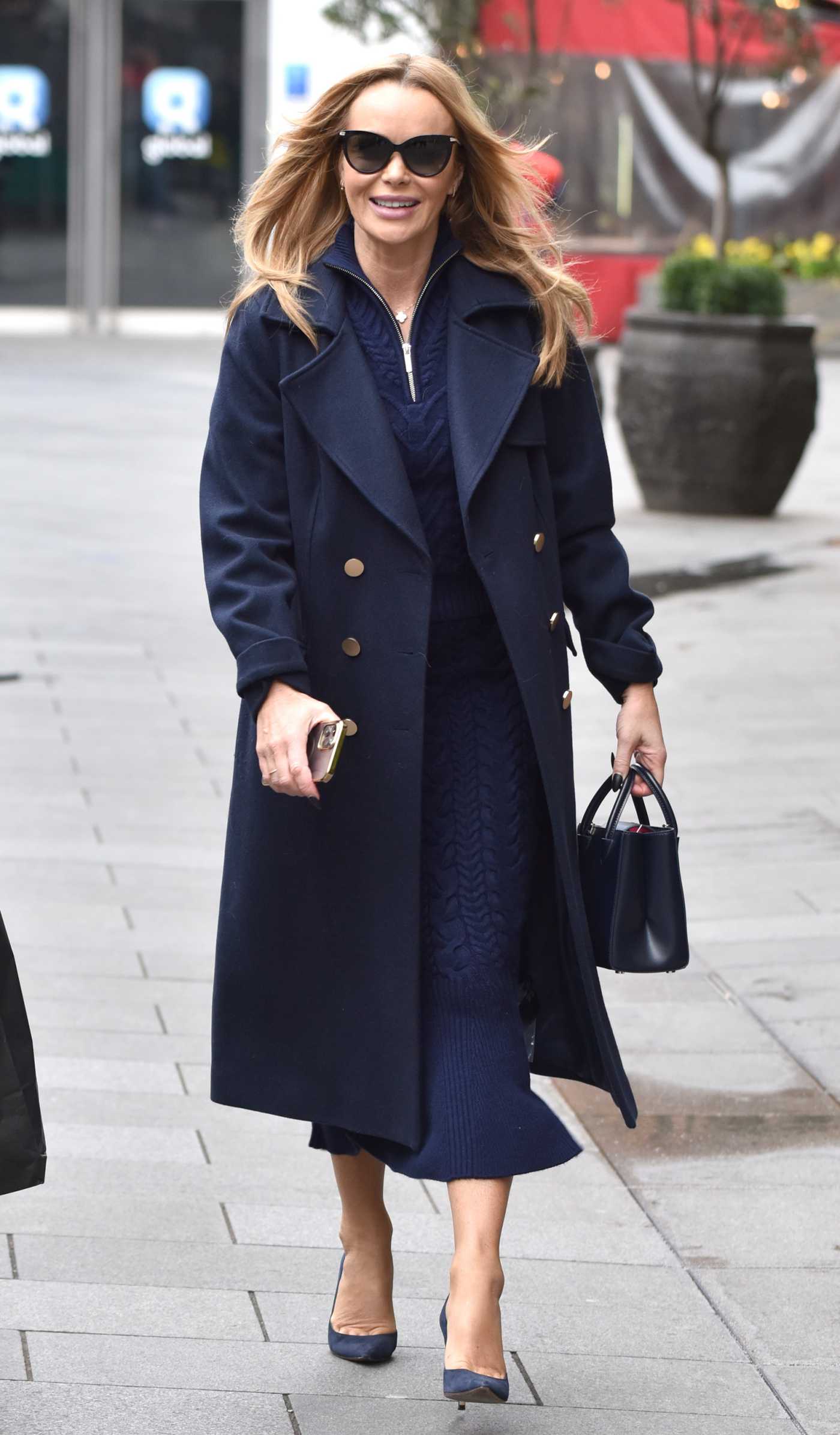 Amanda Holden in a Blue Coat Leaves the Global Radio Studios in London 02/21/2023