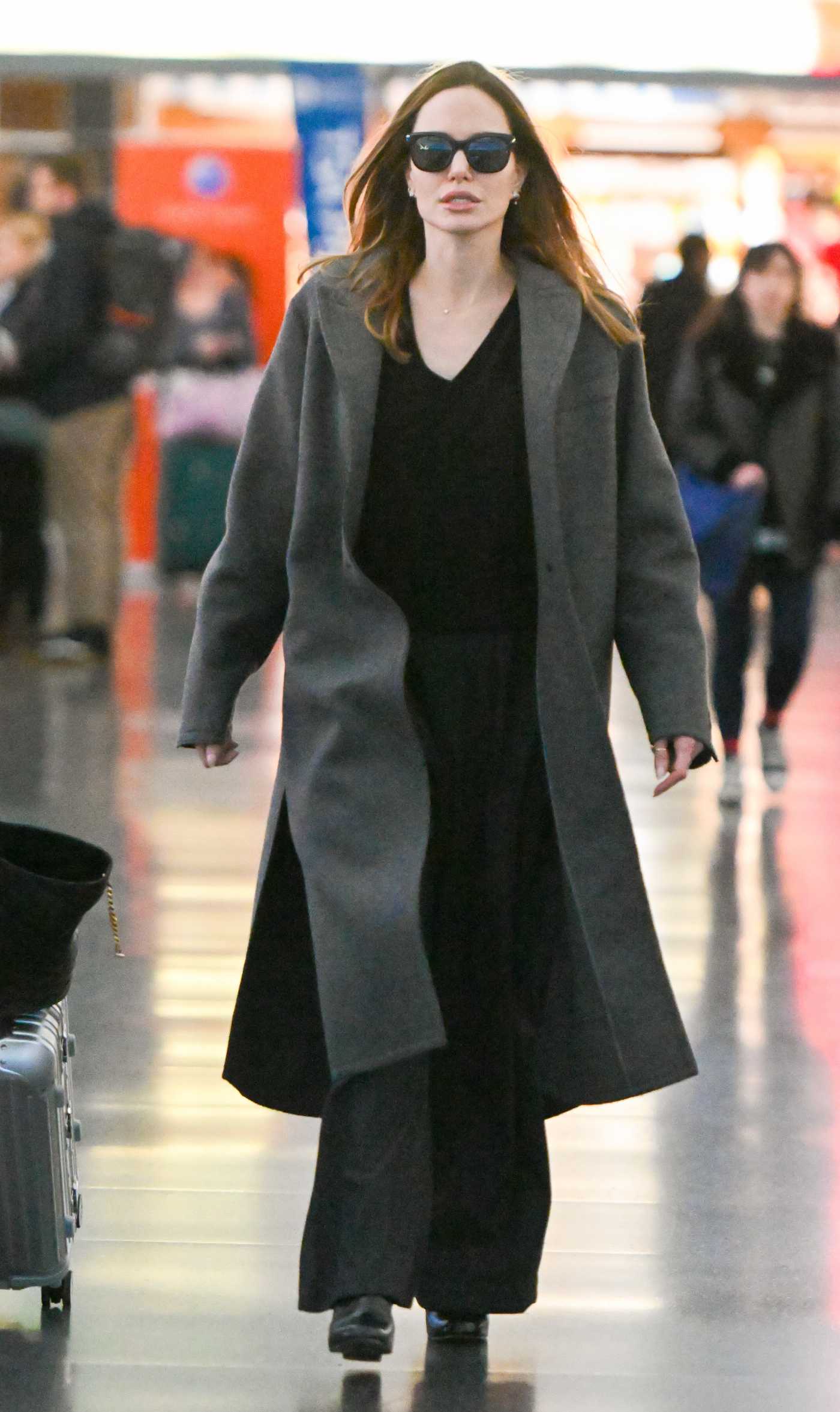 Angelina Jolie in a Grey Coat Arrives at JFK Airport in New York 02/19/2023