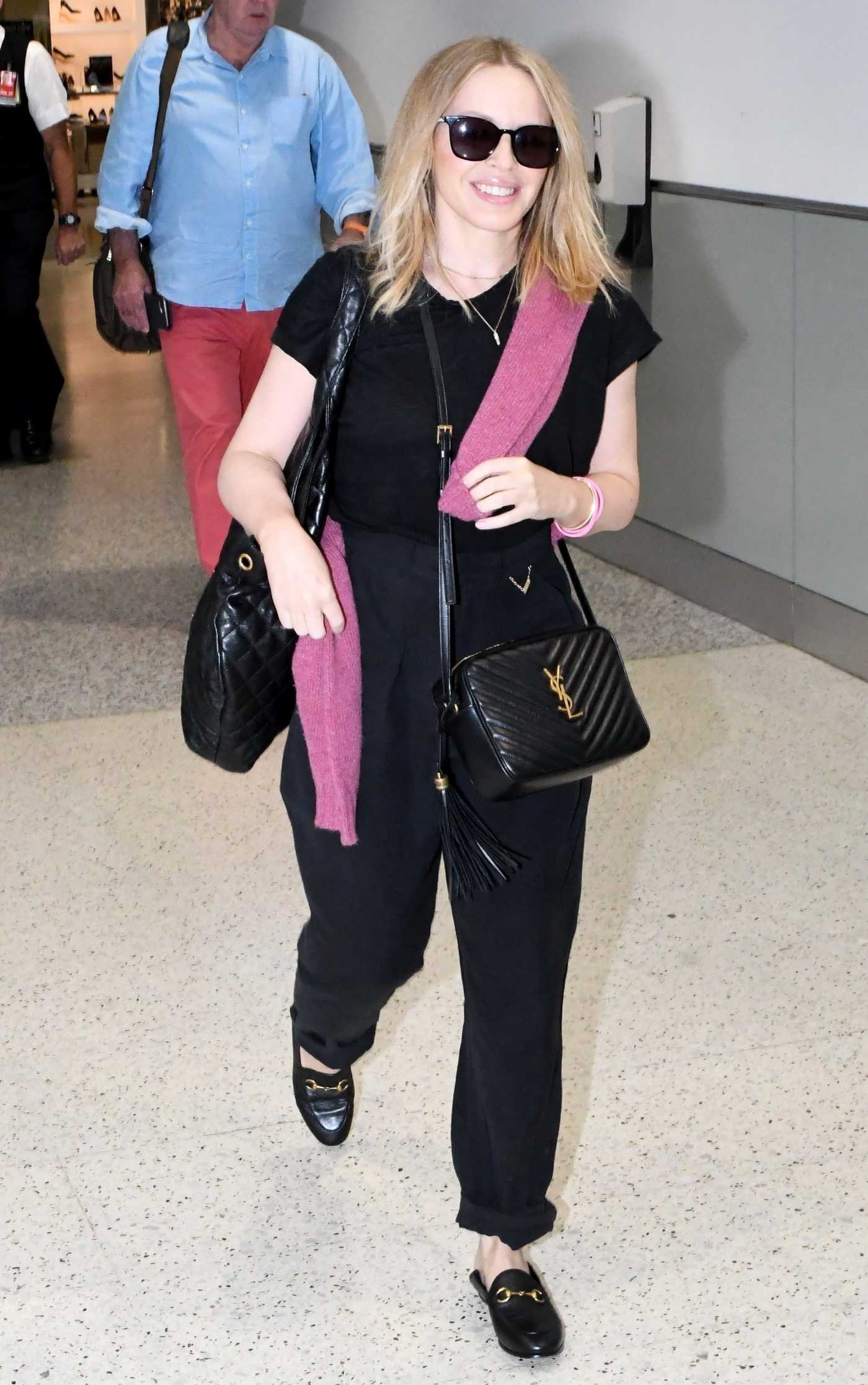 Kylie Minogue in a Black Tee Arrives at Sydney Domestic Airport in Sydney 02/19/2023