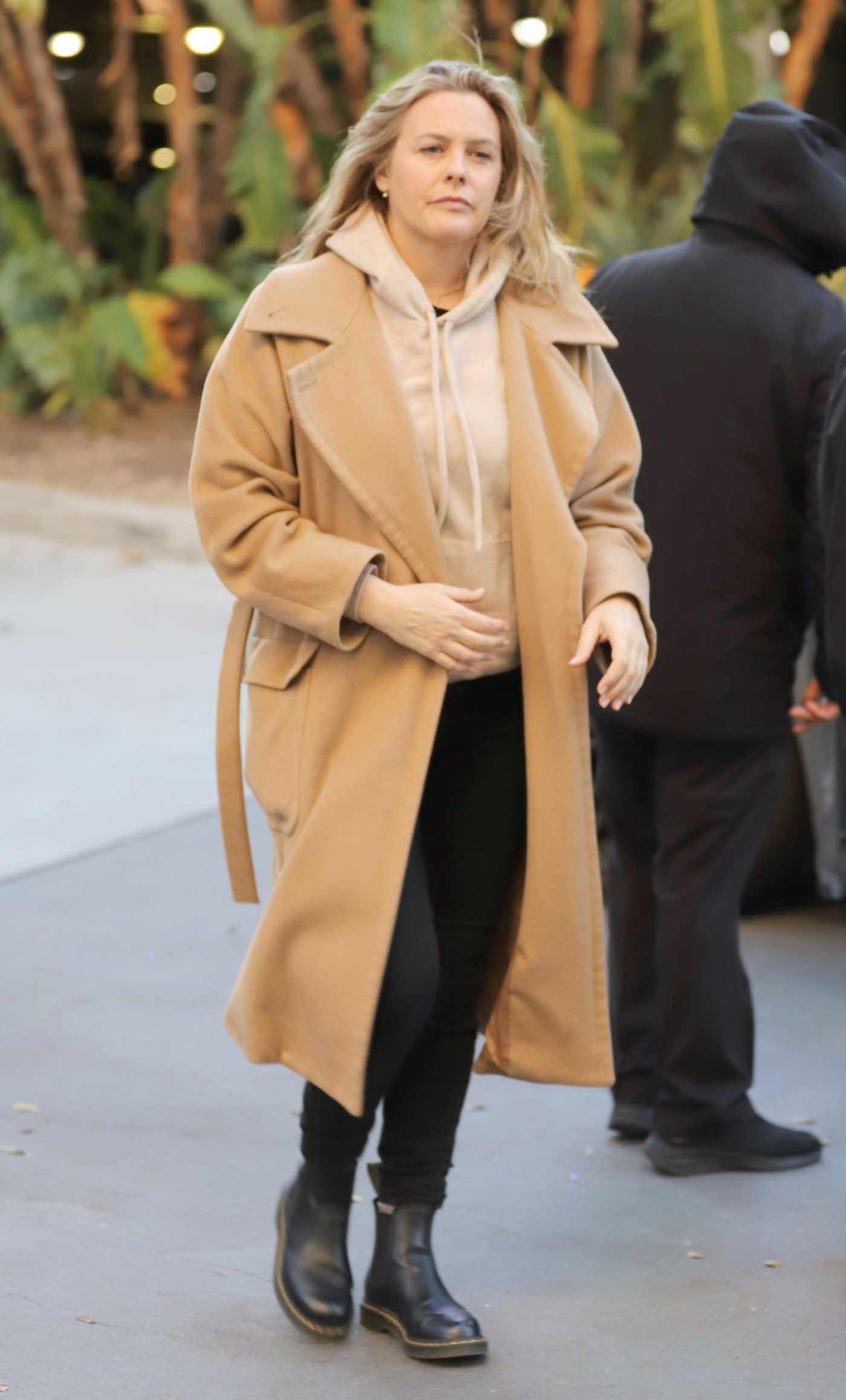 Alicia Silverstone in a Caramel Coloured Coat Arrives at the Lakers Game at the Crypto.com Arena in Los Angeles 03/24/2023