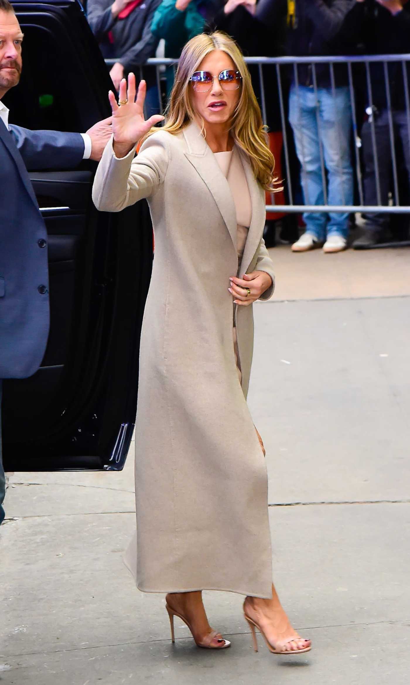 Jennifer Aniston in a Beige Coat Was Seen Out in Midtown in New York City 03/22/2023