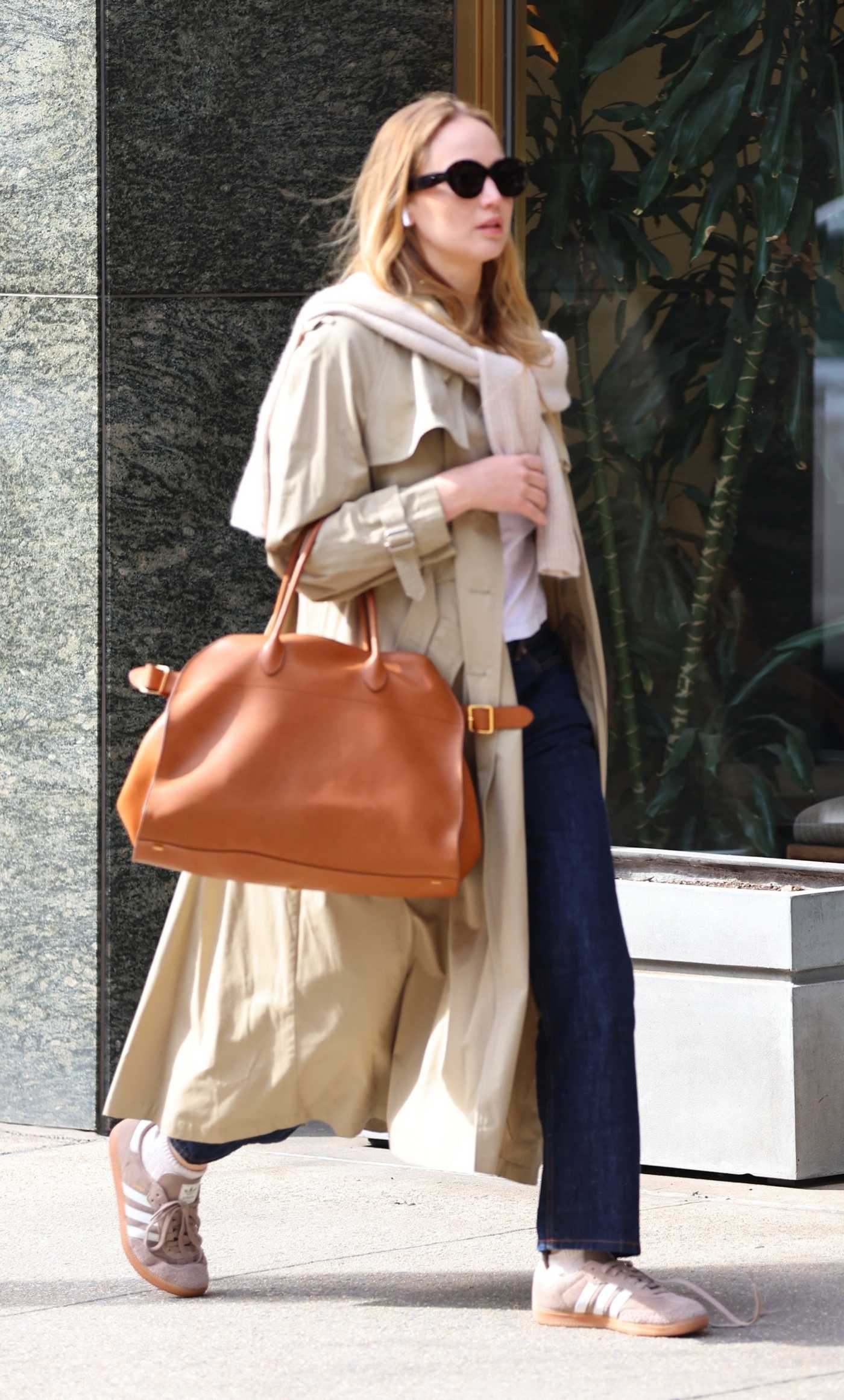 Jennifer Lawrence in a Beige Trench Coat Was Seen Out in New York City 03/24/2023