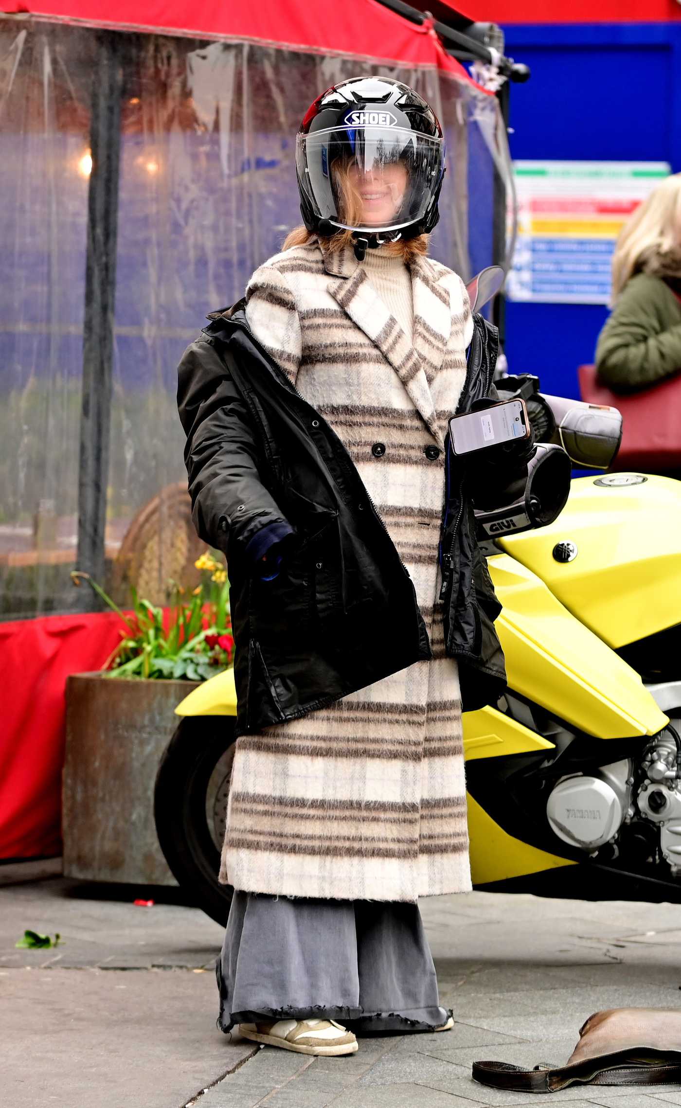 Kate Garraway in a Striped Coat Arrives at the Global Radio Studios in London 03/20/2023