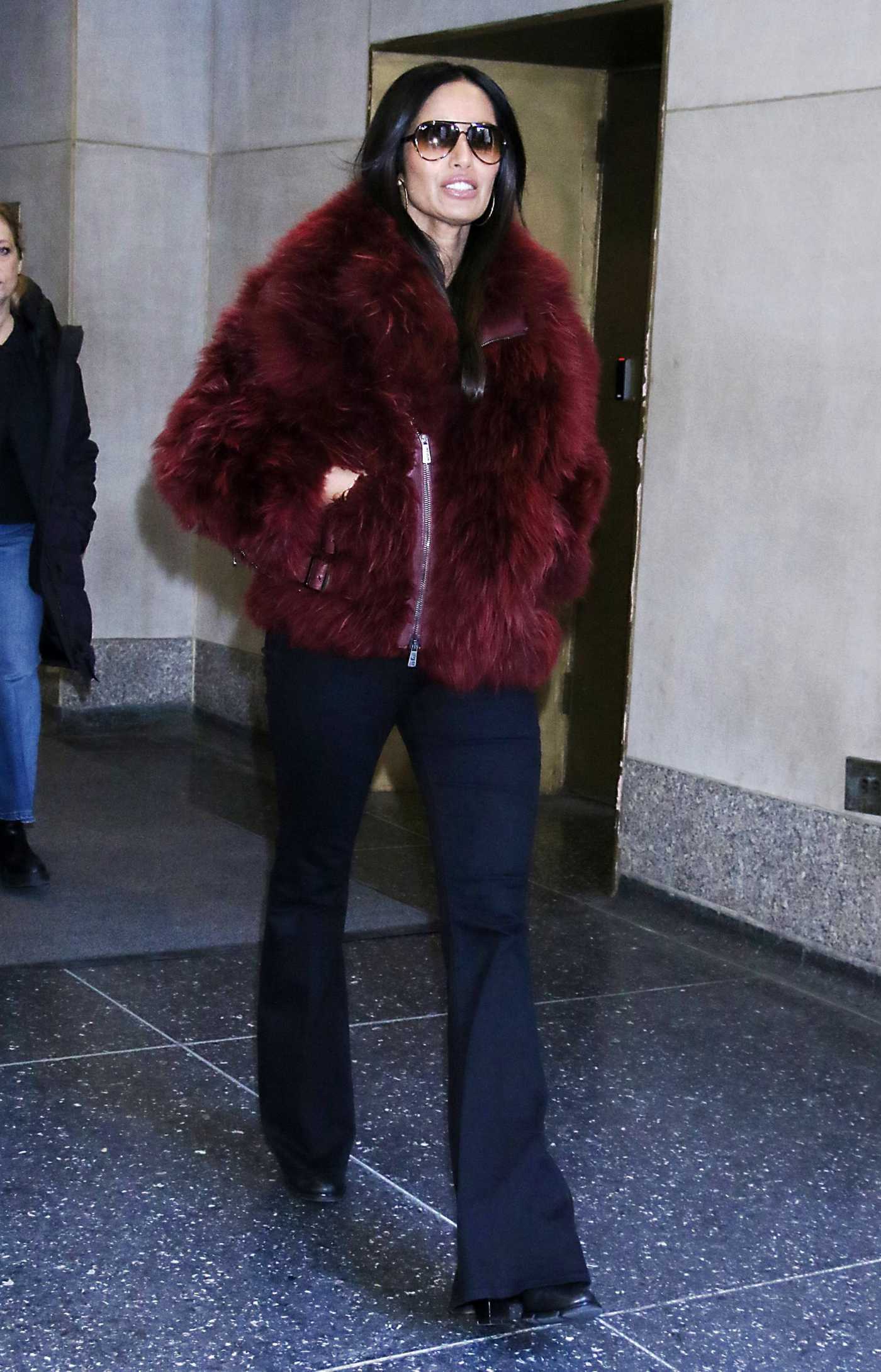 Padma Lakshmi in a Burgundy Fur Coat Arrives at NBC's Today Show in New York 03/07/2023