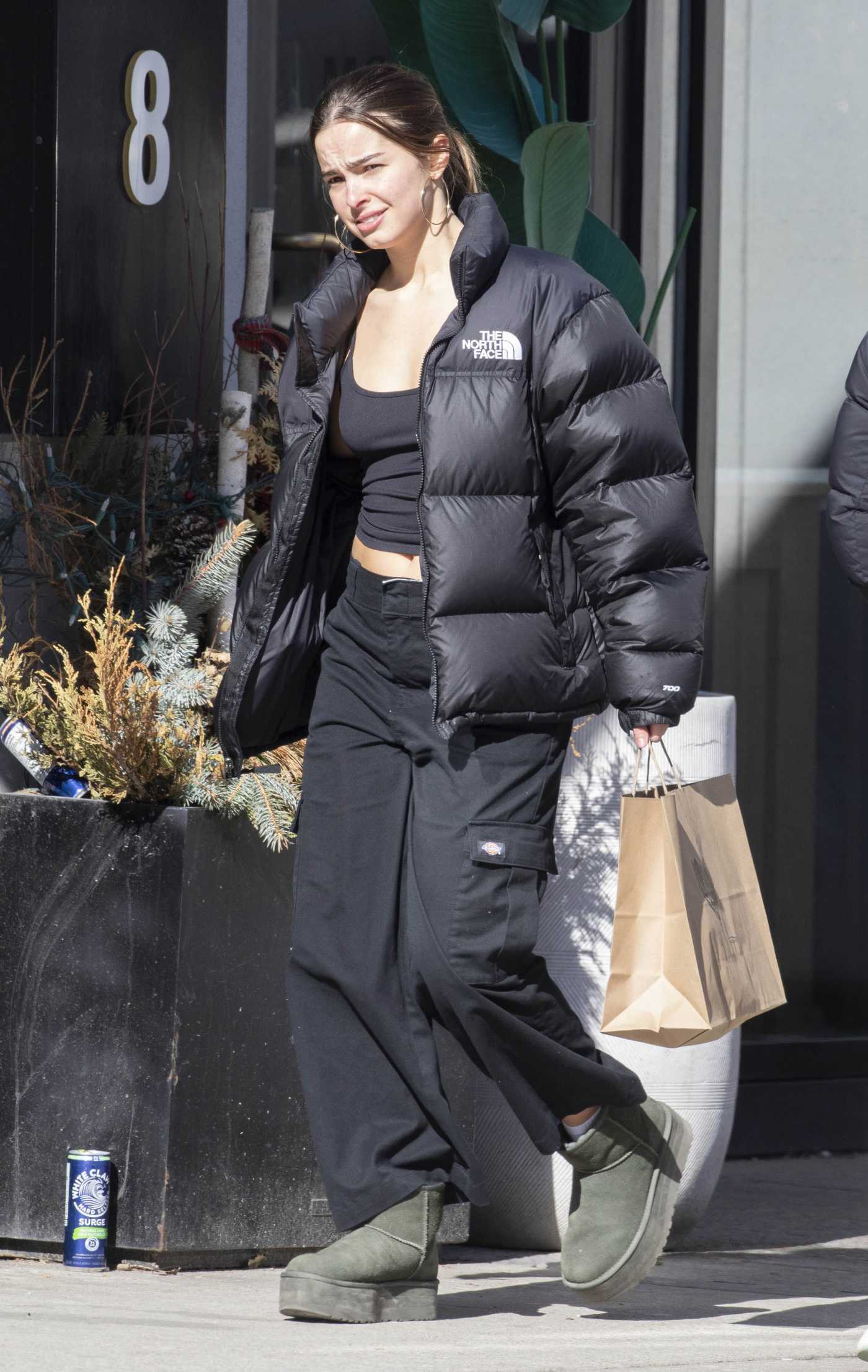 Addison Rae in a Black Puffer Jacket Goes Shopping in Toronto 04/03/2023