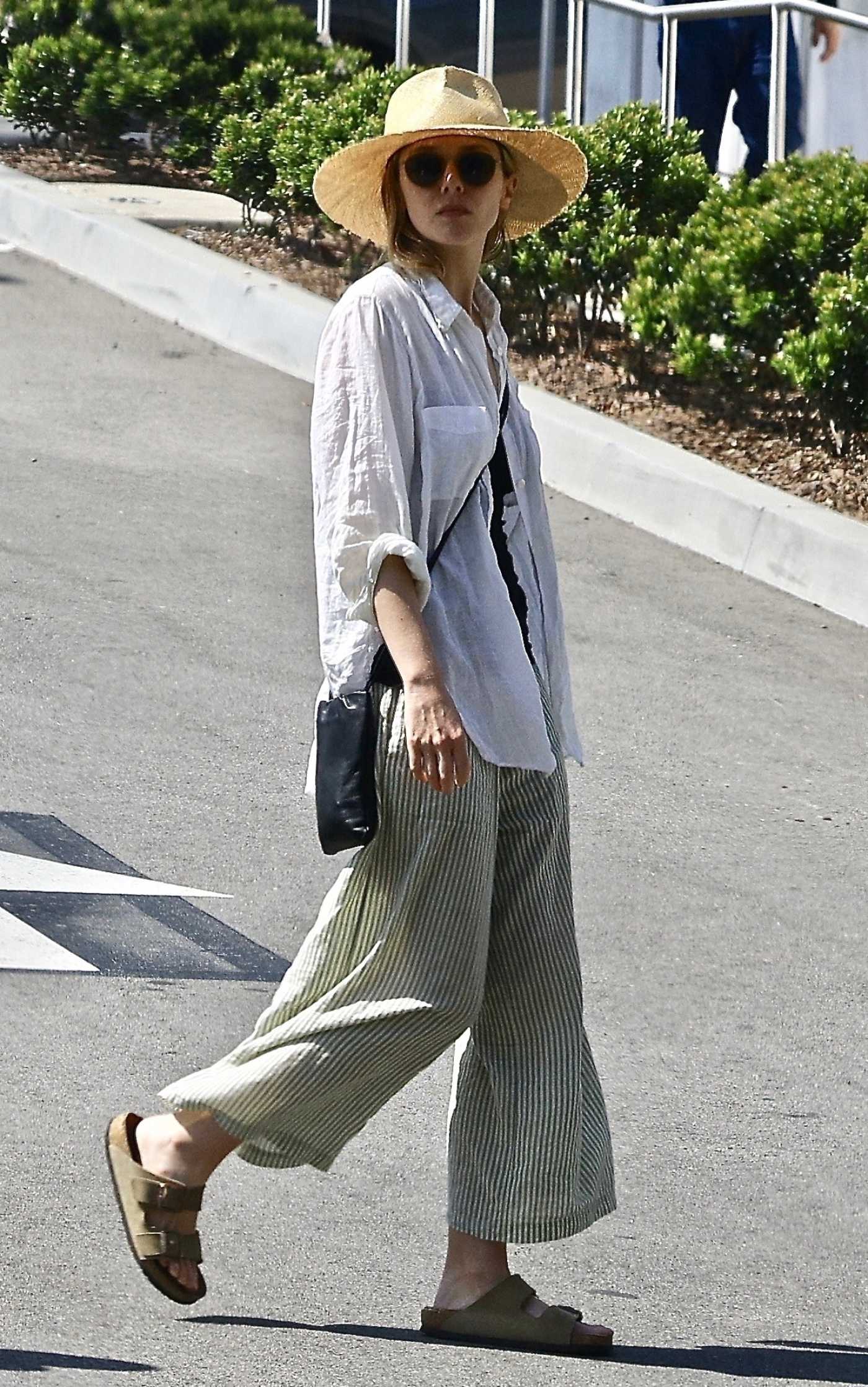 Elizabeth Olsen in a White Shirt Was Seen Out with Her Husband Robbie Arnett in Studio City 04/29/2023