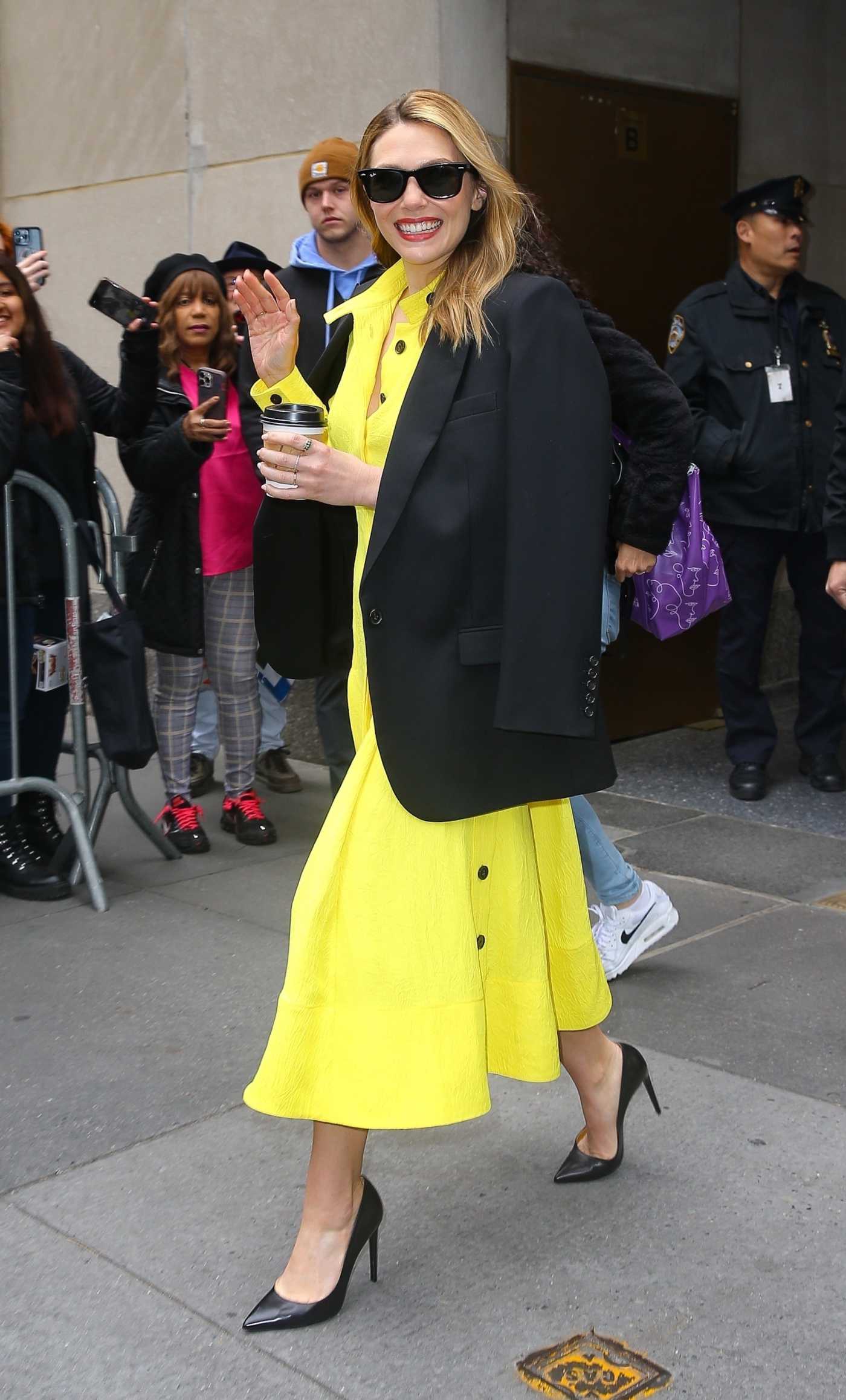 Elizabeth Olsen in a Yellow Dress Arrives at The Today Show in New York 04/19/2023