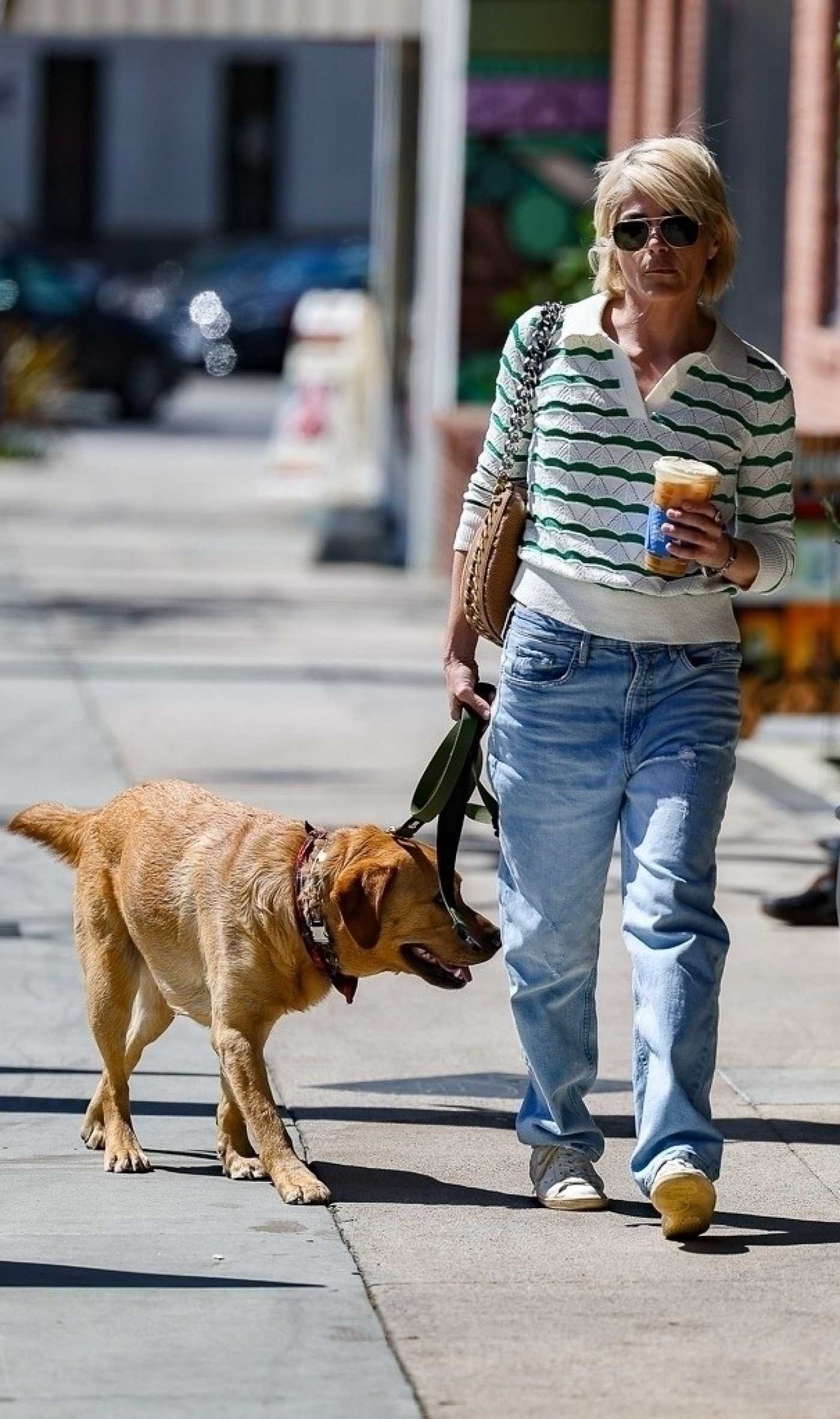 Selma Blair in a Blue Jeans Enjoys Daily Life with Her Service Dog Scout in Studio City 04/19/2023