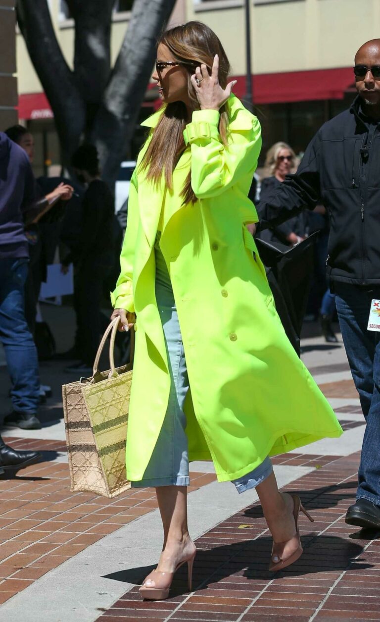Sofia Vergara in a Neon Green Trench Coat