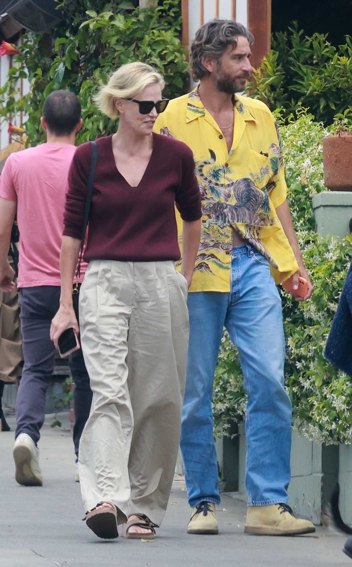 Charlize Theron in a Beige Pants Leaves Lunch with Model Alex Dimitrijevic at All Time Restaurant in Los Angeles 05/16/2023