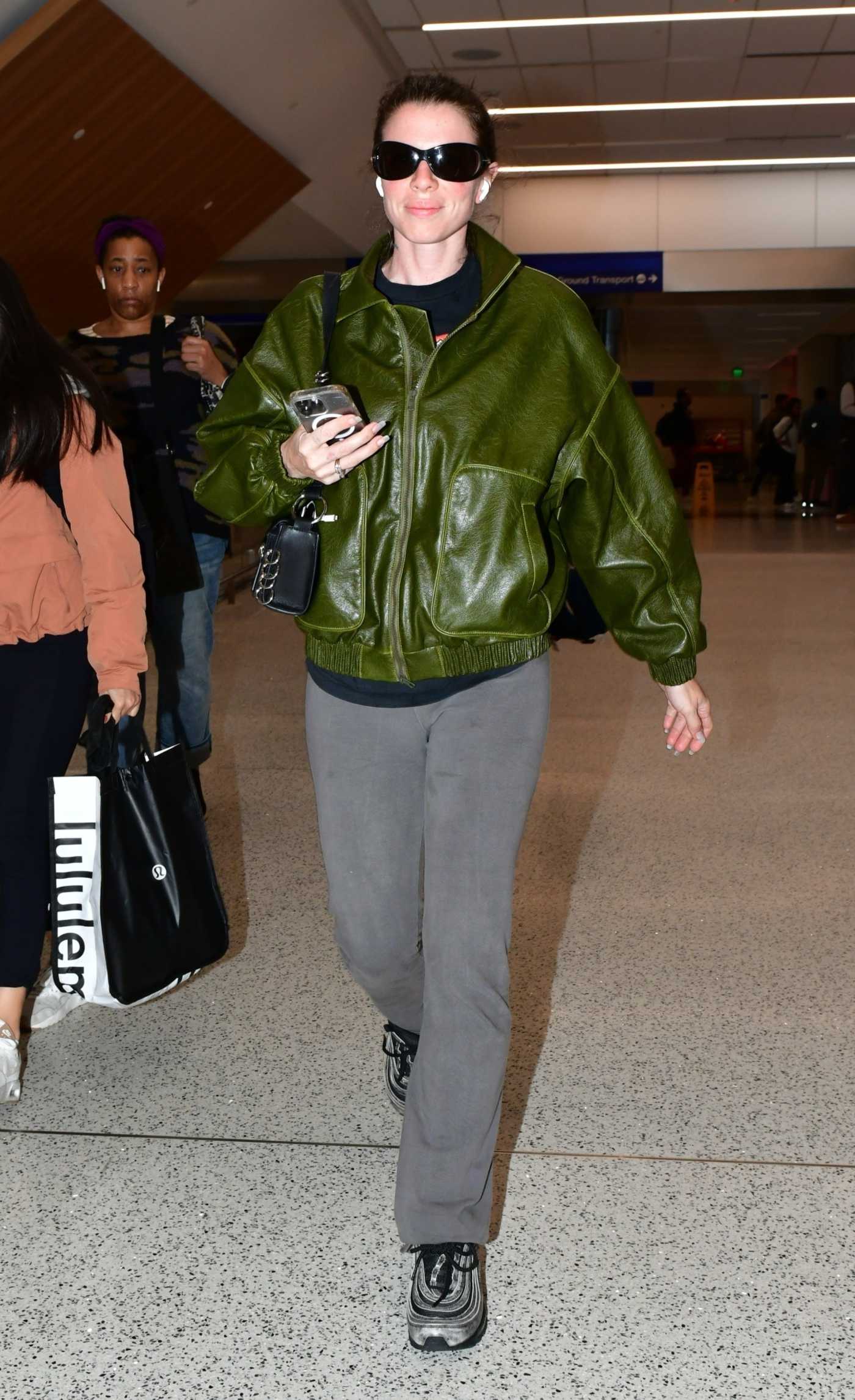 Julia Fox in an Olive Leather Jacket Arrives at LAX Airport in Los Angeles 05/08/2023