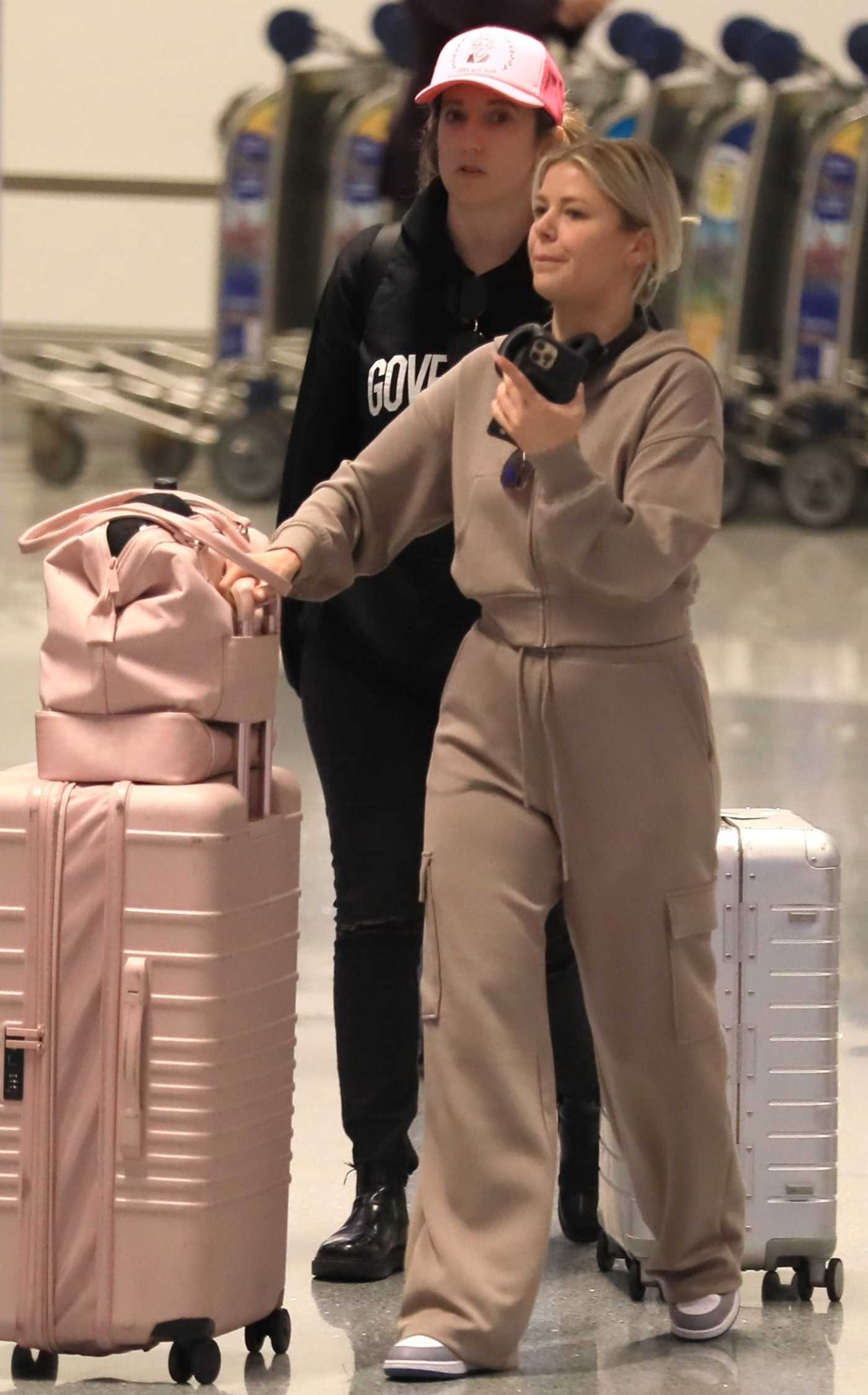Ariana Madix in a Beige Sweatsuit Arrives at LAX Airport in LA 06/14/2023
