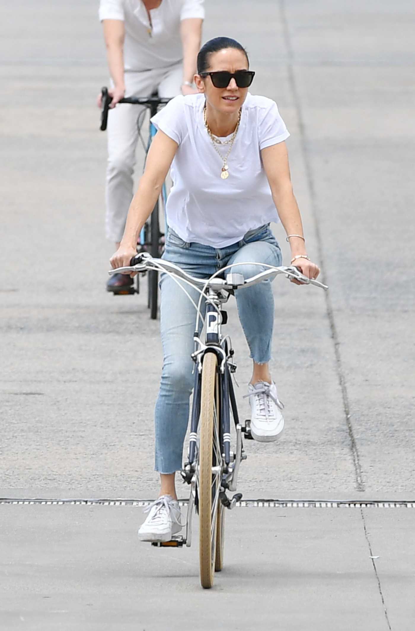 Jennifer Connelly in a White Tee Was Spotted on a Bike Ride in New York 06/19/2023