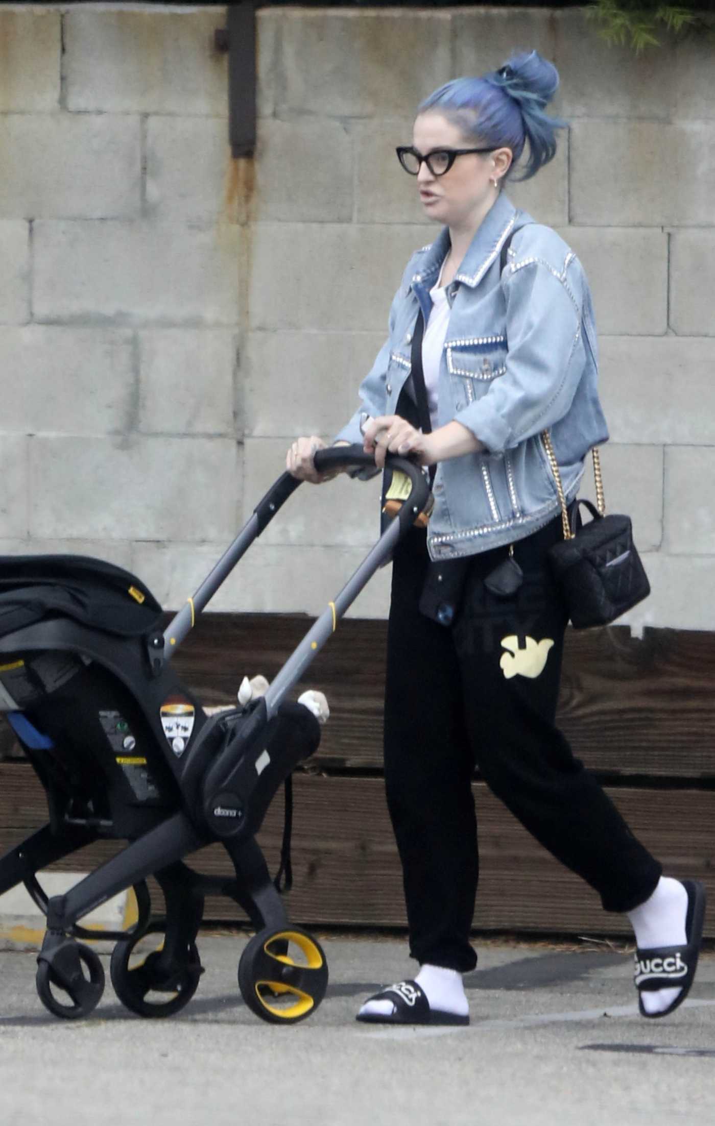Kelly Osbourne in a Blue Denim Jacket Visits a Friend's House with Her Baby Boy Sidney in Los Angeles 05/30/2023