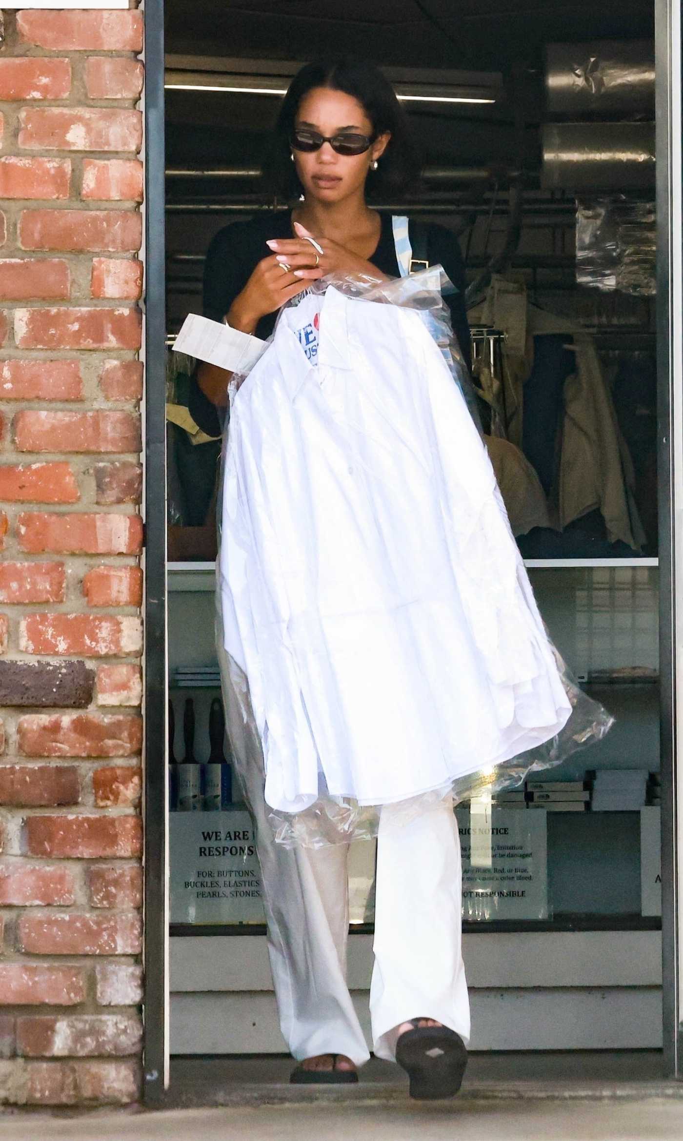 Laura Harrier in a White Pants Leaves a Dry Cleaners in Los Feliz 06/03/2023