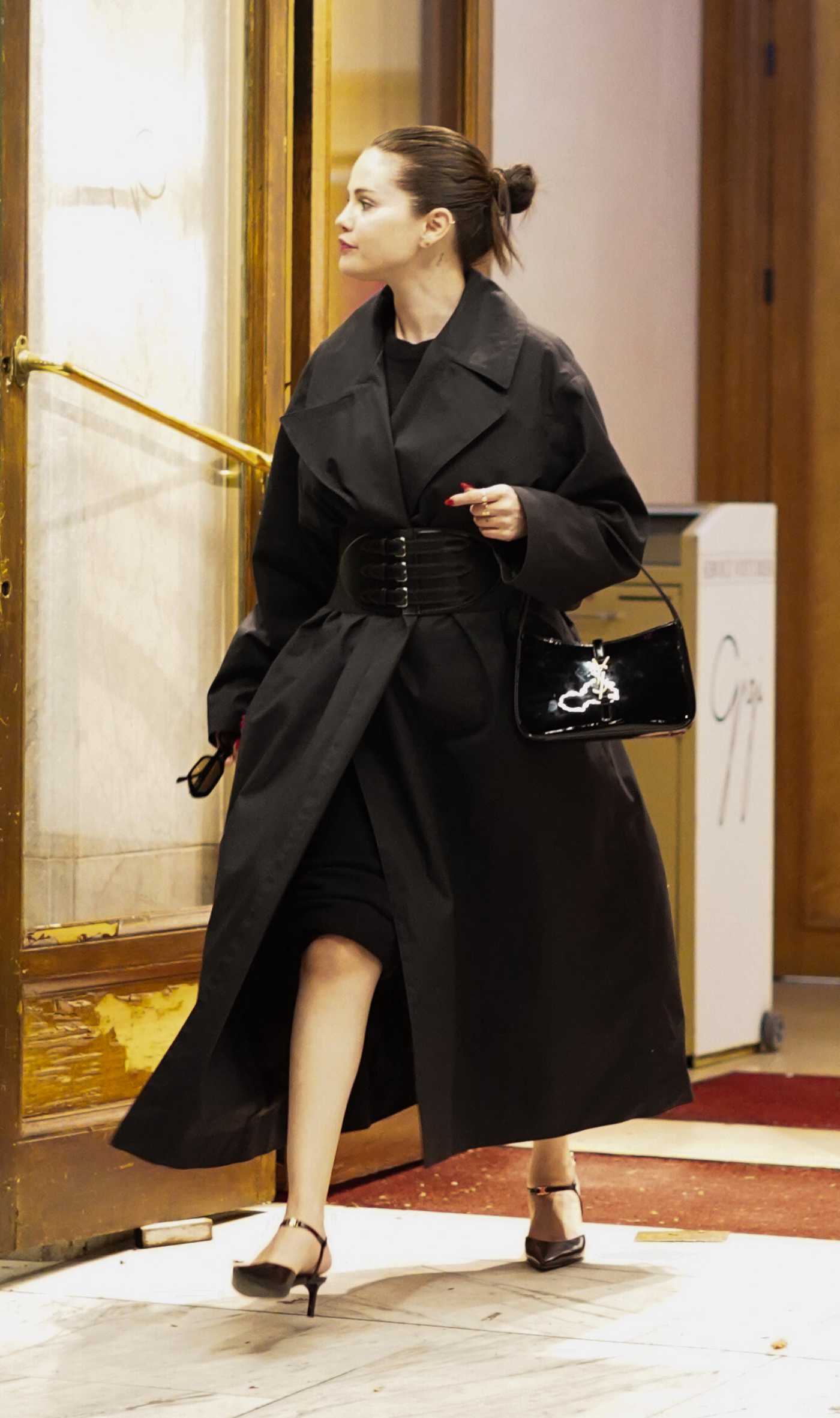 Selena Gomez in a Black Trench Coat Leaves Dinner at Manko in Paris 06/20/2023