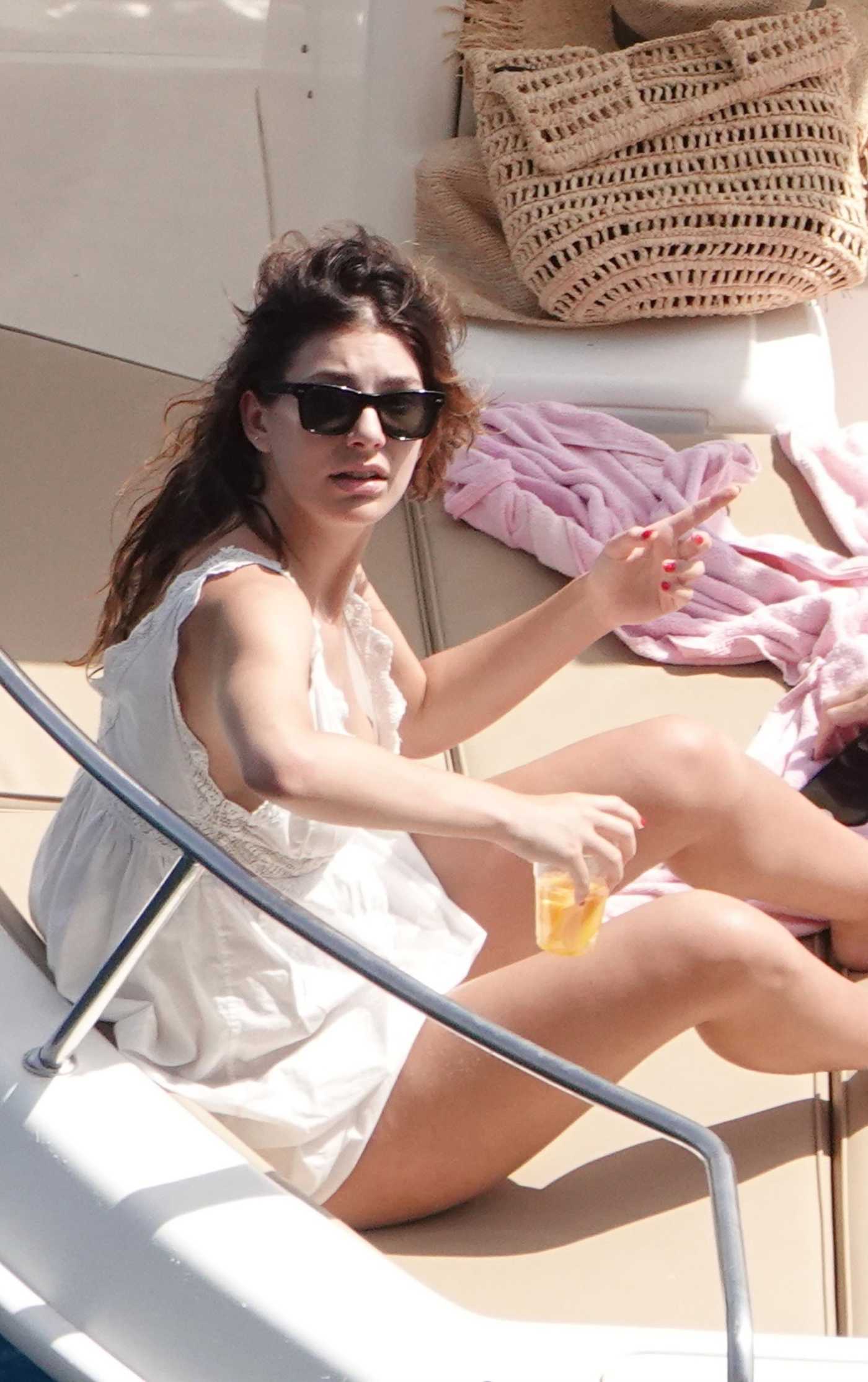 Camila Morrone in a White Sundress on the Boat in the Amalfi Coast 07/20/2023