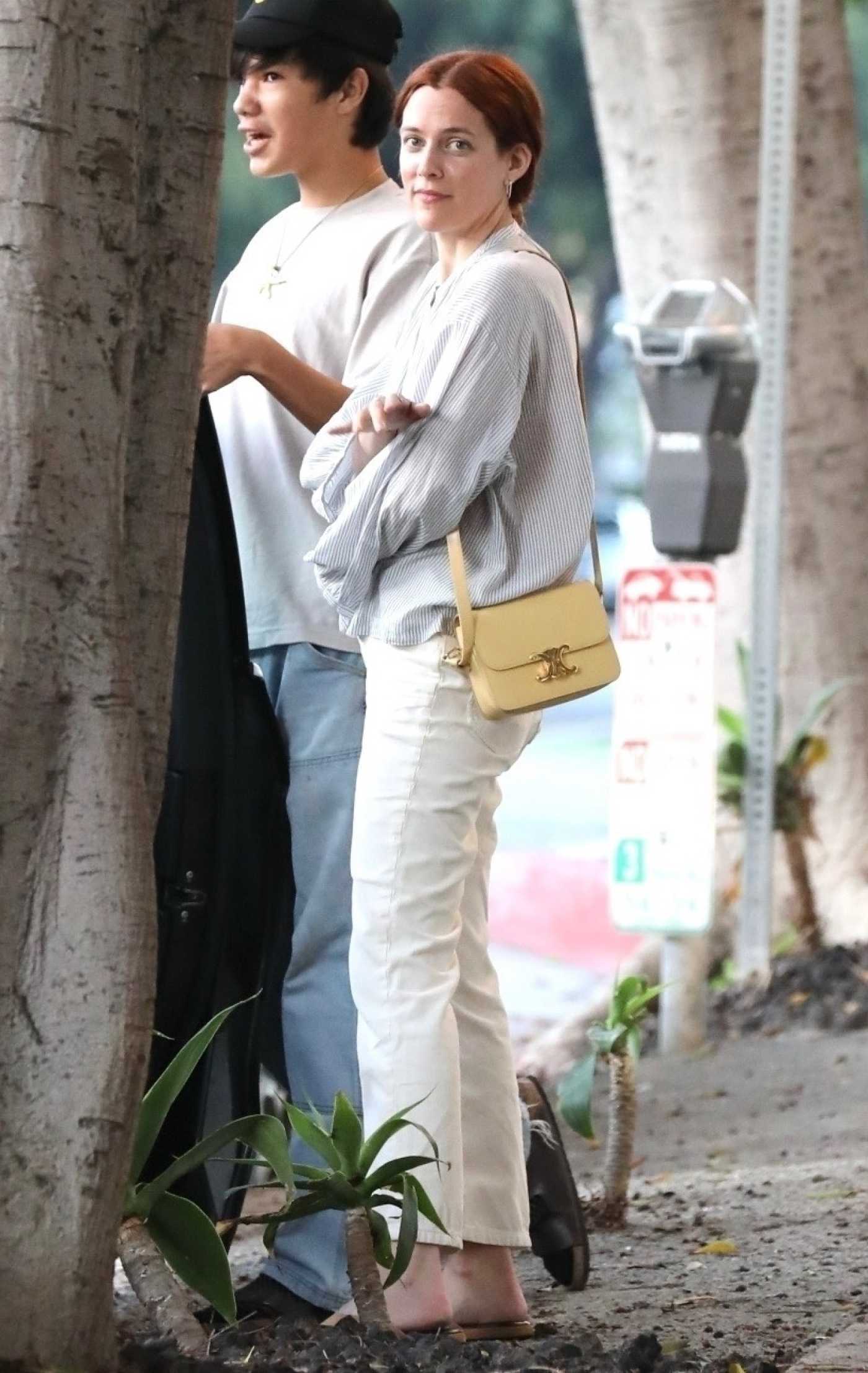 Riley Keough in a White Pants Has Dinner with Friends at Margo's Pizza Kitchen in Santa Monica 07/19/2023