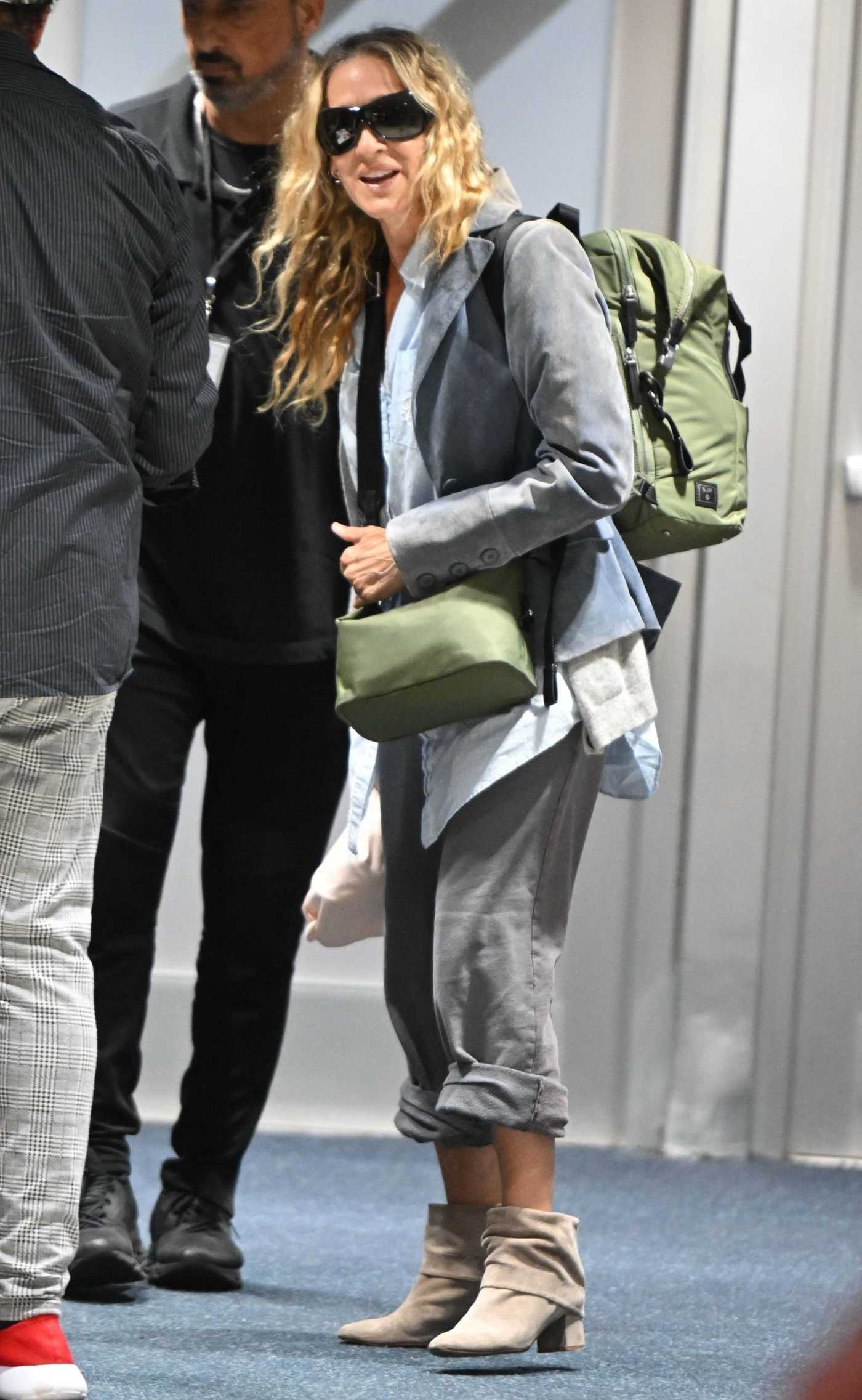 Sarah Jessica Parker in a Grey Pants Arrives at JFK Airport in New York 07/15/2023