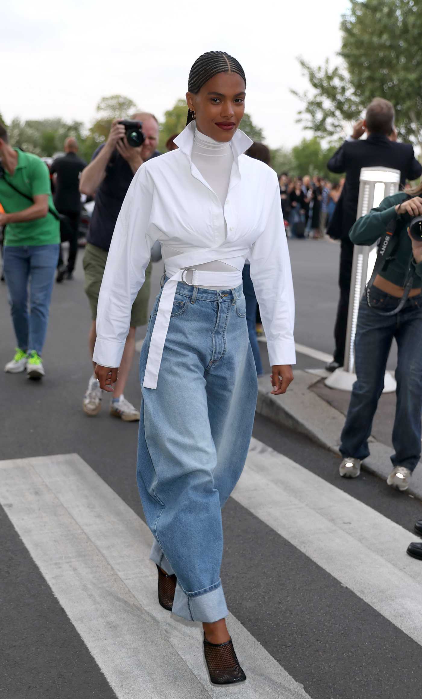 Tina Kunakey in a Blue Jeans Leaves the Azzedine Alaia Fashion Show During 2023 Paris Fashion Week in Paris 07/03/2023