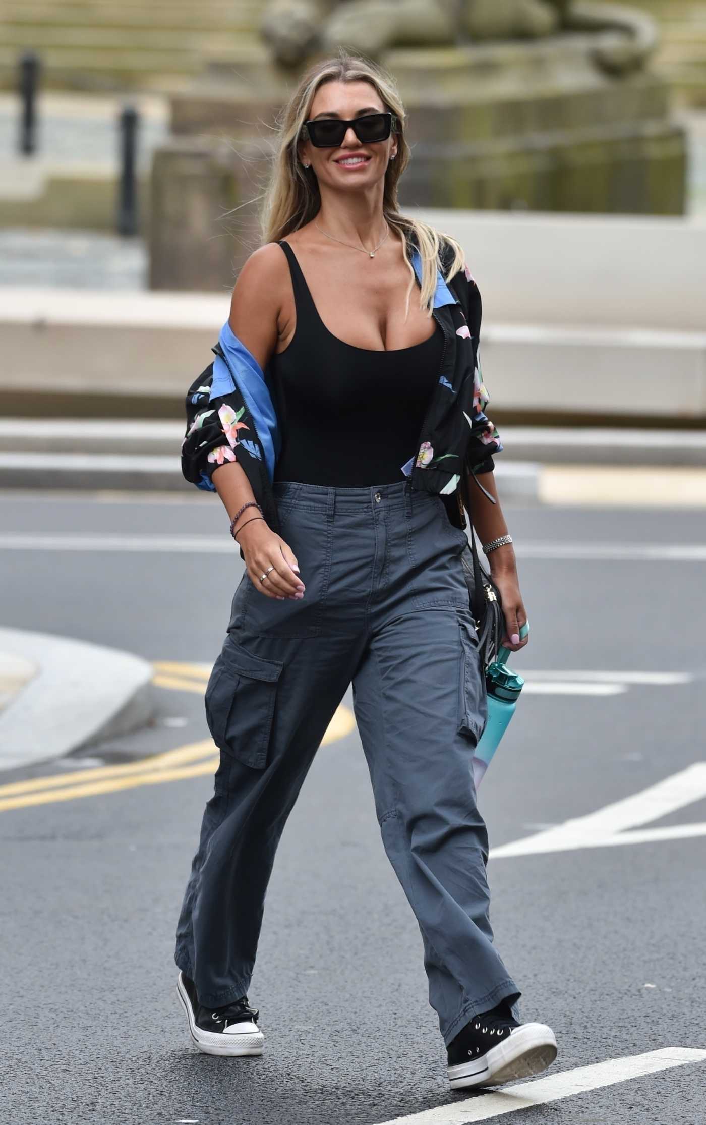 Christine McGuinness in a Black Top Leaves Radio City After Presenting the Breakfast Show in Liverpool 08/24/2023