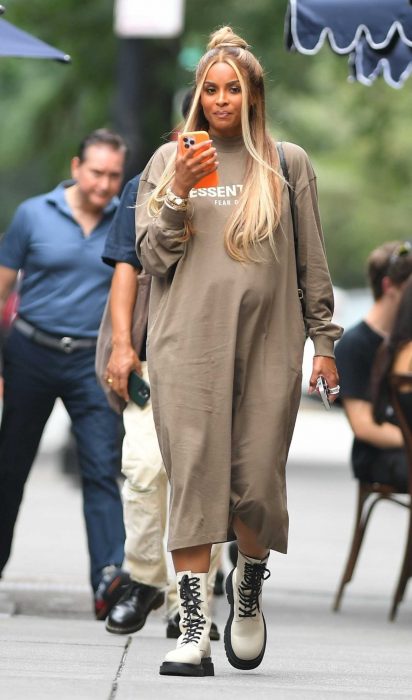 Ciara in a Tan Long-Sleeve Midi Dress
