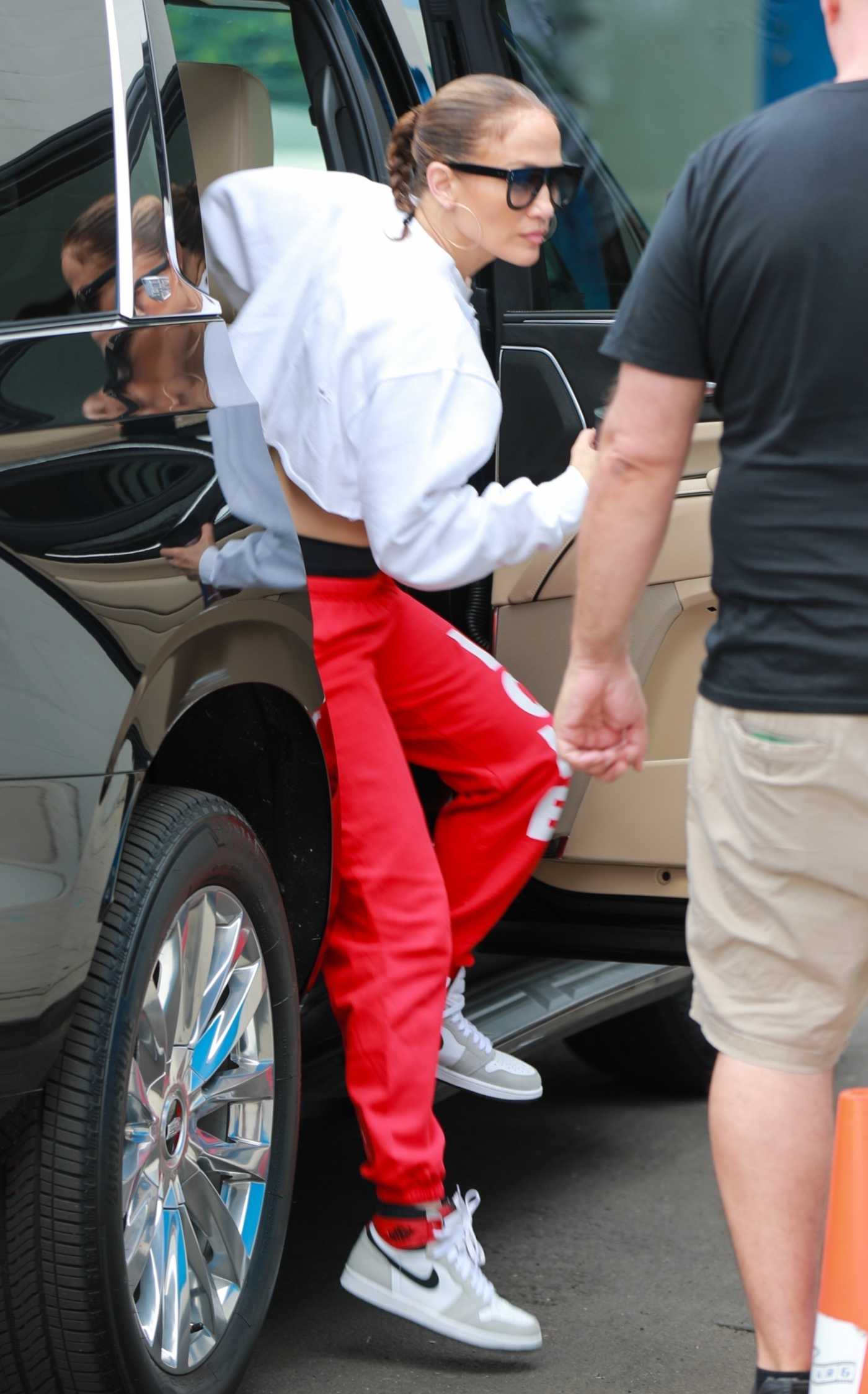 Jennifer Lopez in a Red Sweatpants Arrives at a New Dance Studio in Los Angeles 09/16/2023