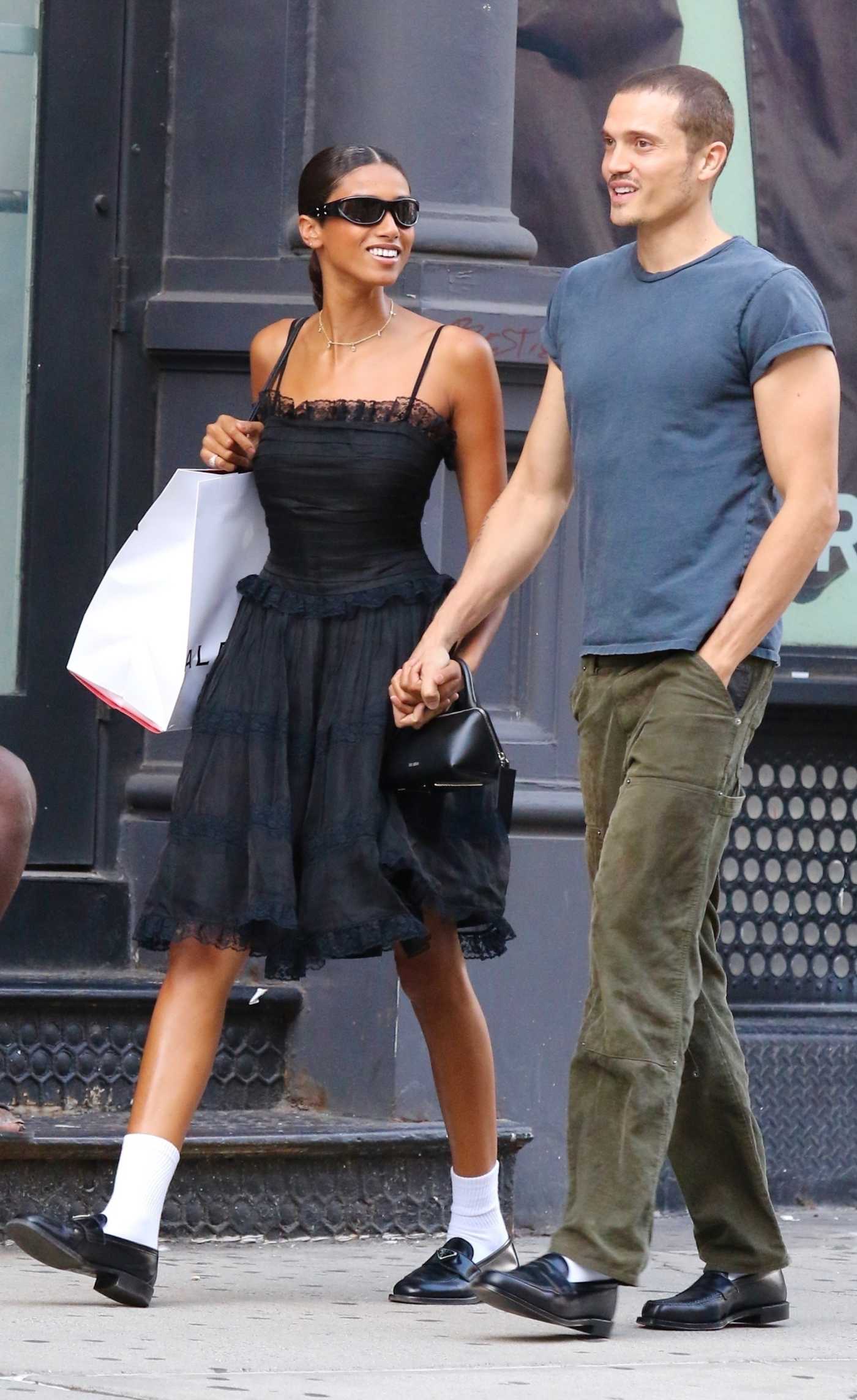 Imaan Hammam in a Black Dress Goes Shopping in Manhattan’s SoHo Neighborhood with Karl Glusman in NYC 08/30/2023